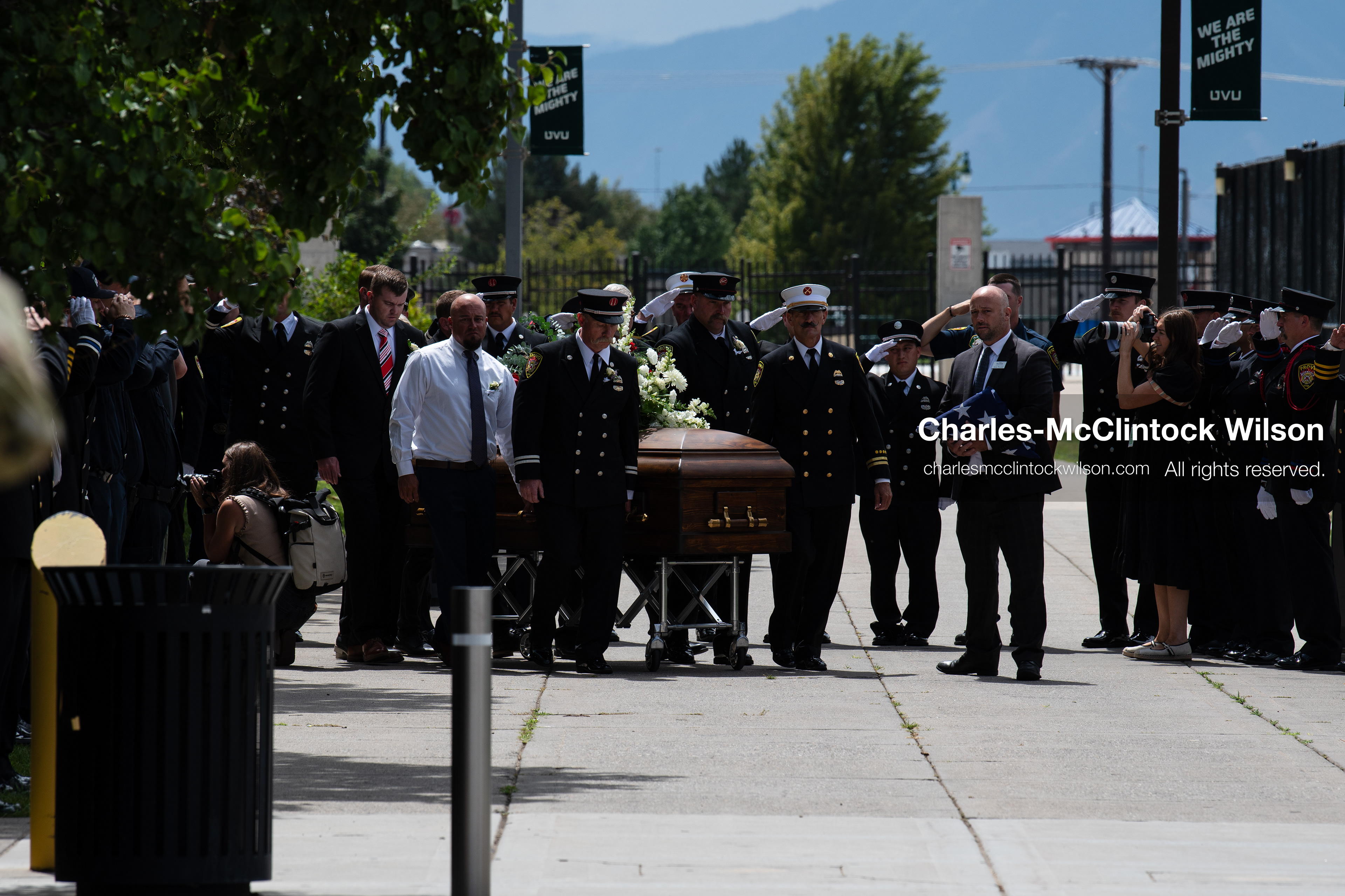 Firefighters and pallbearers escort the casket of Provo Fire Captain Spencer Long outside the UCCU Center on the campus of Utah Valley University in Orem, Utah, on Wednesday, July 29, 2026. More than 300 people came to the public memorial ceremony to honor Captain Long, his wife Katrina, and three of their sons, who died after a flash flood hit their campsite near the Sunglow Campground in Wayne County. (Photo by Charles-McClintock Wilson/Sipa USA)