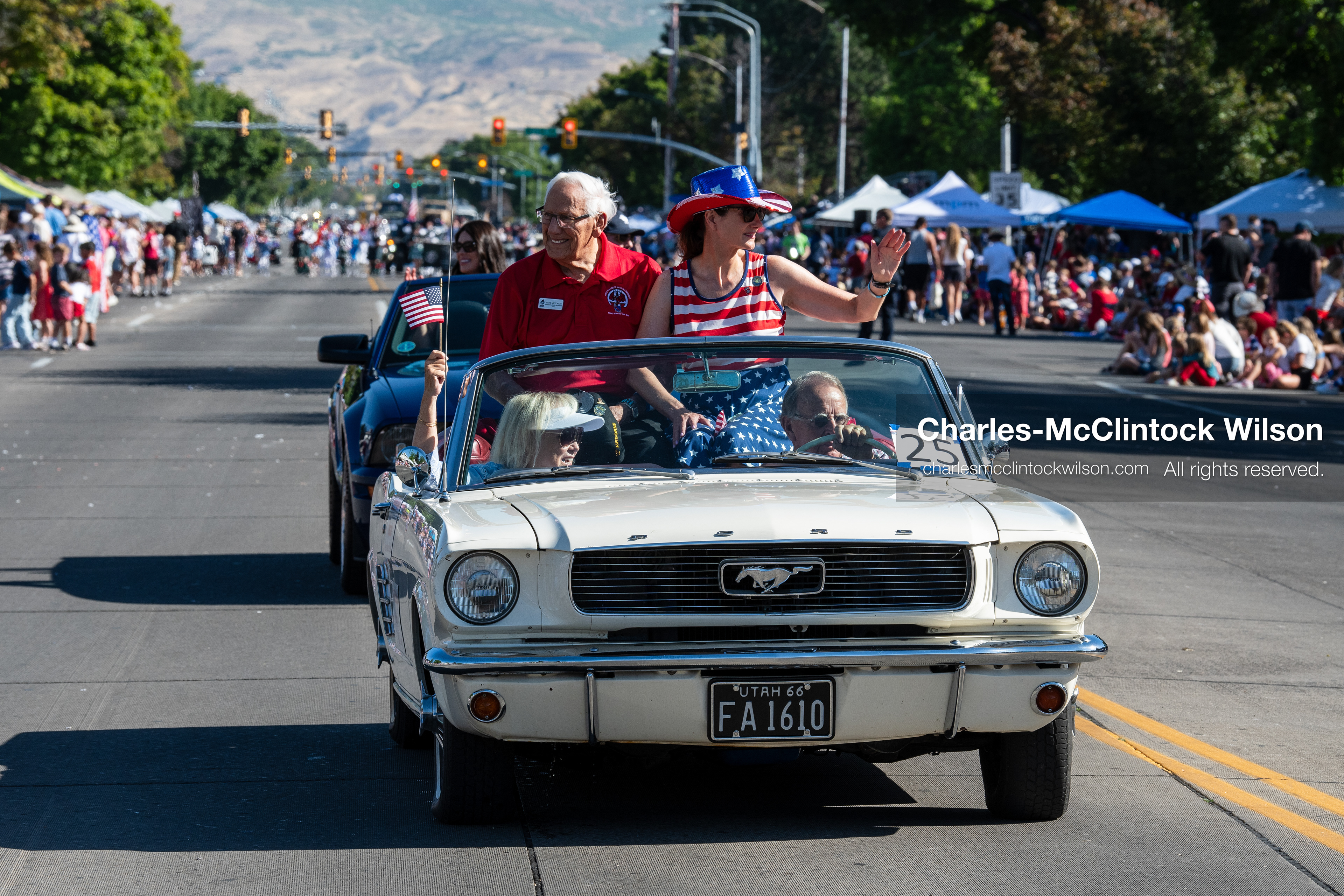 July 4, 2026, Provo, Utah, USA: A white classic convertible car carrying parade participants drives down the street during America's Freedom Festival Grand Parade in Provo, Utah, Saturday, July 4, 2026. The annual event drew thousands of spectators to the downtown corridor. (Credit Image: © Charles-McClintock Wilson/ZUMA Press Wire)