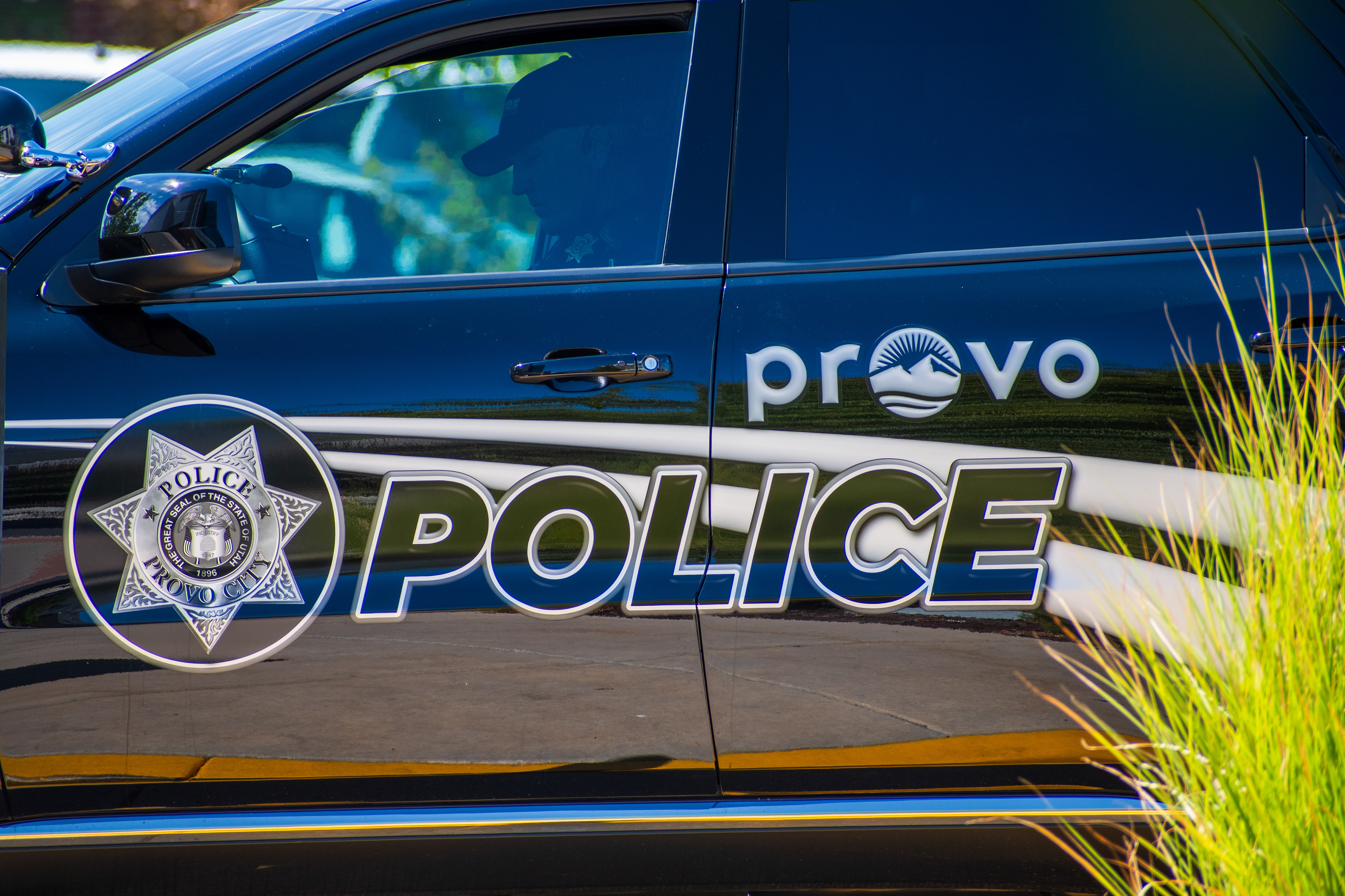 September 15, 2025 – Provo, Utah, United States: A Provo Police Department vehicle is parked near the Utah Valley Convention Center during a Department of Homeland Security career expo focused on recruiting law enforcement and security personnel. A nearby sign offers digital parking assistance via QR code. Photograph by Charles‑McClintock Wilson / ZUMA Press Wire