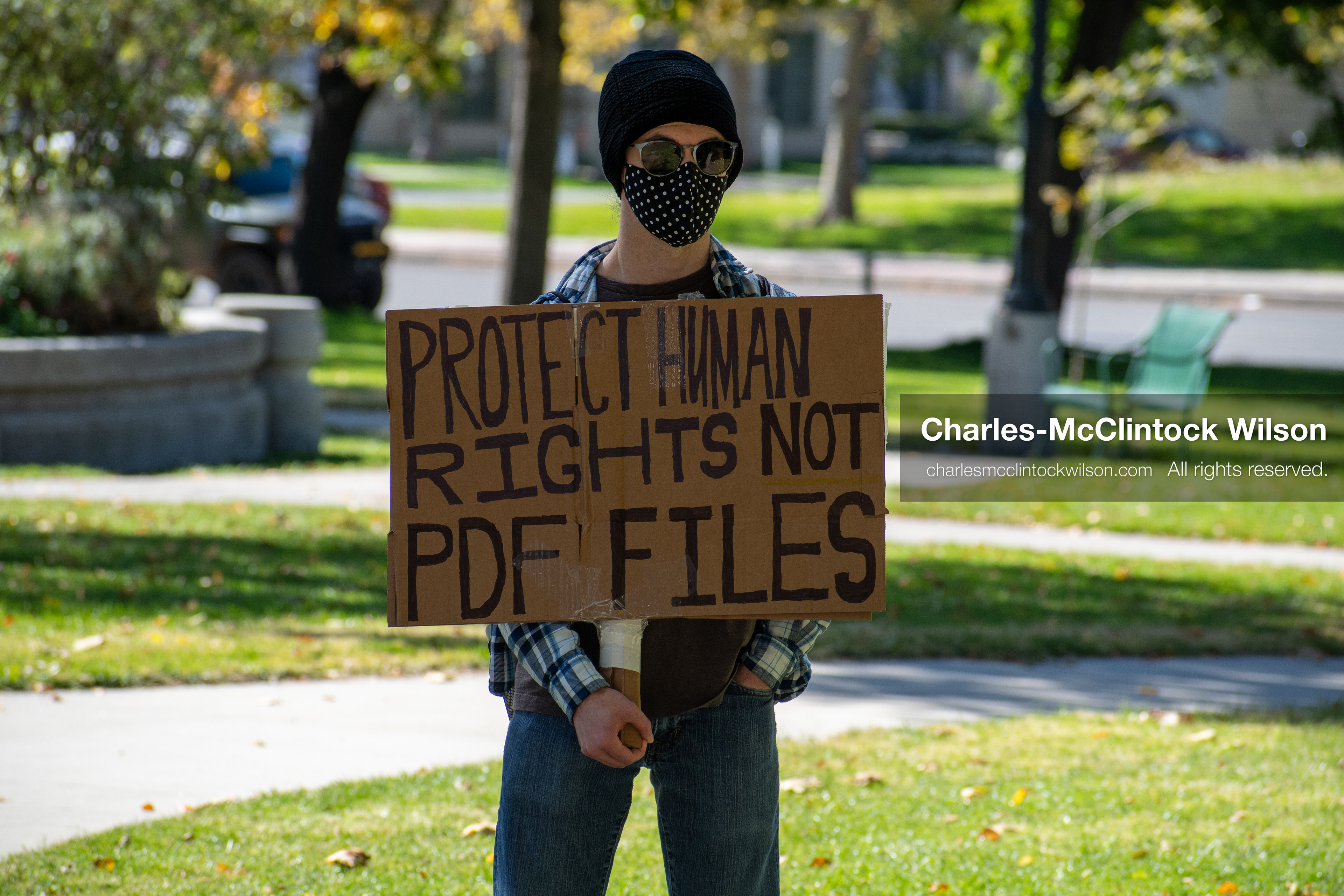 October 18, 2025, Salt Lake City, Utah, USA: A demonstrator holds a satirical protest sign during a "No Kings" rally at Washington Square Park in Salt Lake City, Utah. The protest was part of a nationwide mobilization.