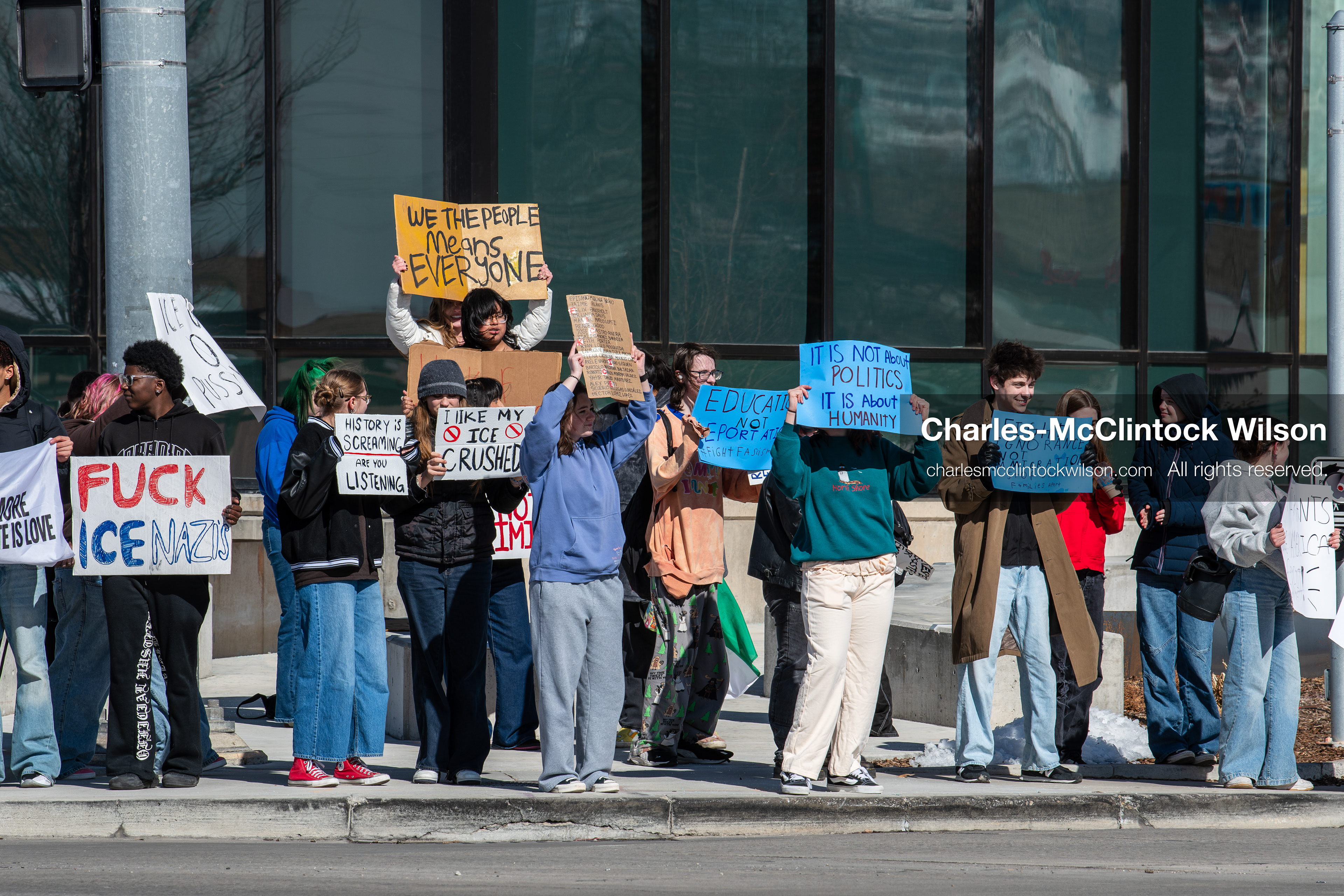 February 20, 2026, Orem, Utah, USA: High school students gather along State Street in front of Orem City Hall during a student led protest against ICE and federal immigration enforcement. Demonstrators hold signs as they stand near the roadway while traffic continues through the area. (Credit Image: © Charles McClintock Wilson/ZUMA Press Wire)