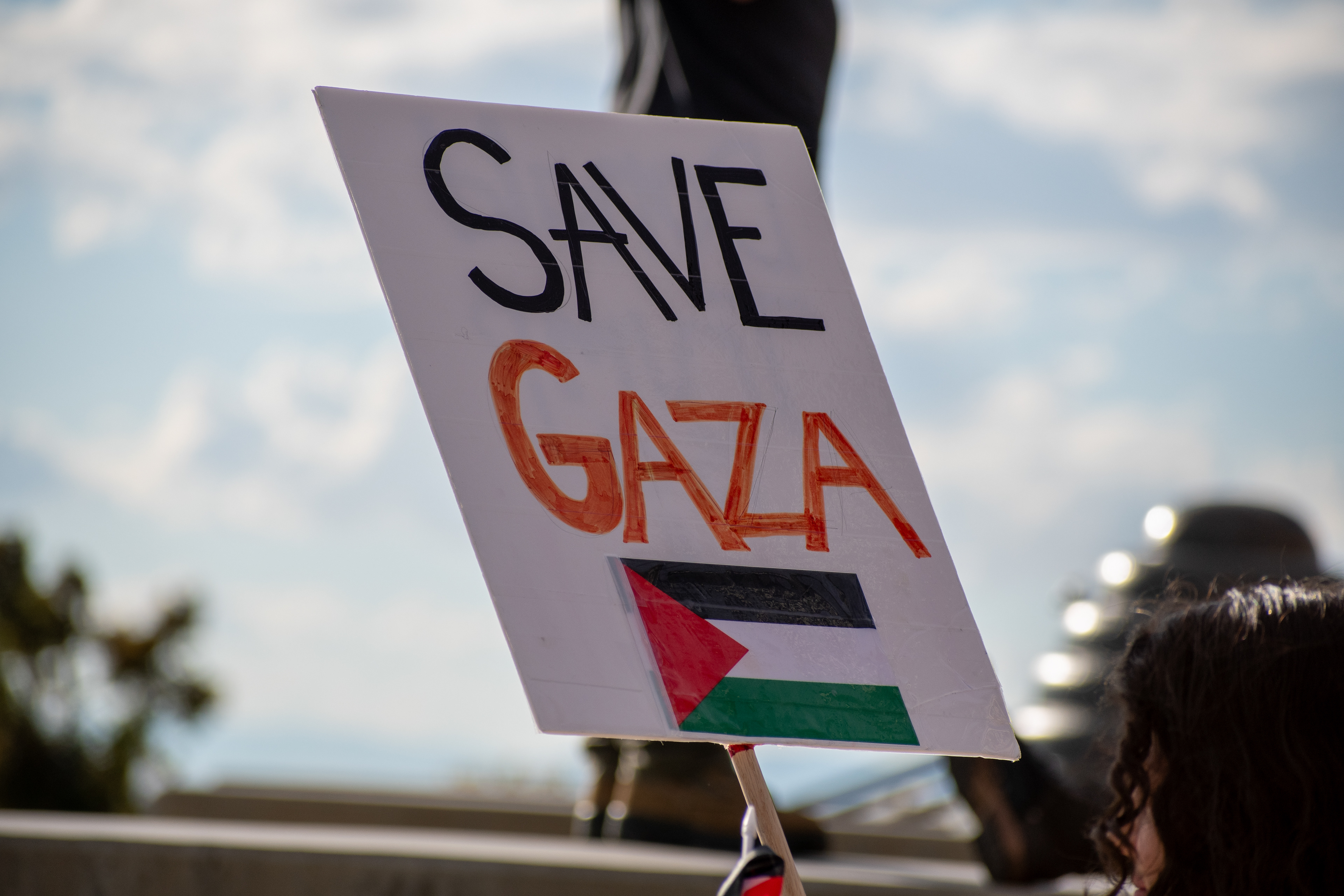 October 10, 2025, Salt Lake City, Utah, USA: A demonstrator holds a sign reading â€œSAVE GAZAâ€ during the Free Palestine Rally organized in front of the Utah State Capitol. The sign features the Palestinian flag as participants gather in support of Palestinian rights. (Credit Image: © Charles-McClintock Wilson/ZUMA Press Wire)