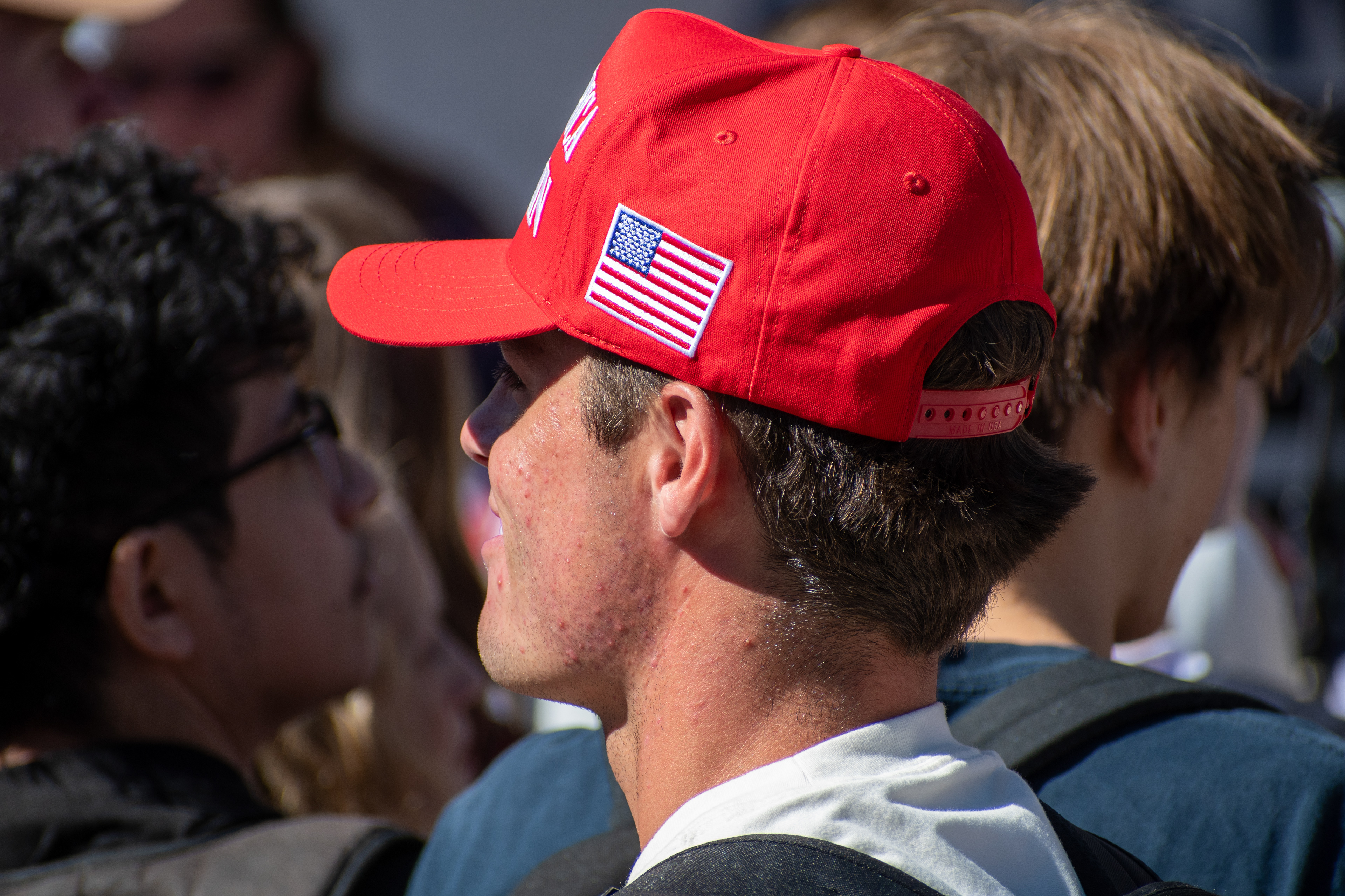 OREM, UTAH – SEPTEMBER 10, 2025: Attendees stand shoulder to shoulder at Utah Valley University during the opening stop of the American Comeback Tour. Framed in partial profile, the image captures a moment of quiet observation and collective presence within the crowd. It reflects the emotional texture and spatial intimacy of a public gathering shaped by anticipation and civic engagement. © Charles-McClintock Wilson / ZUMA Press
