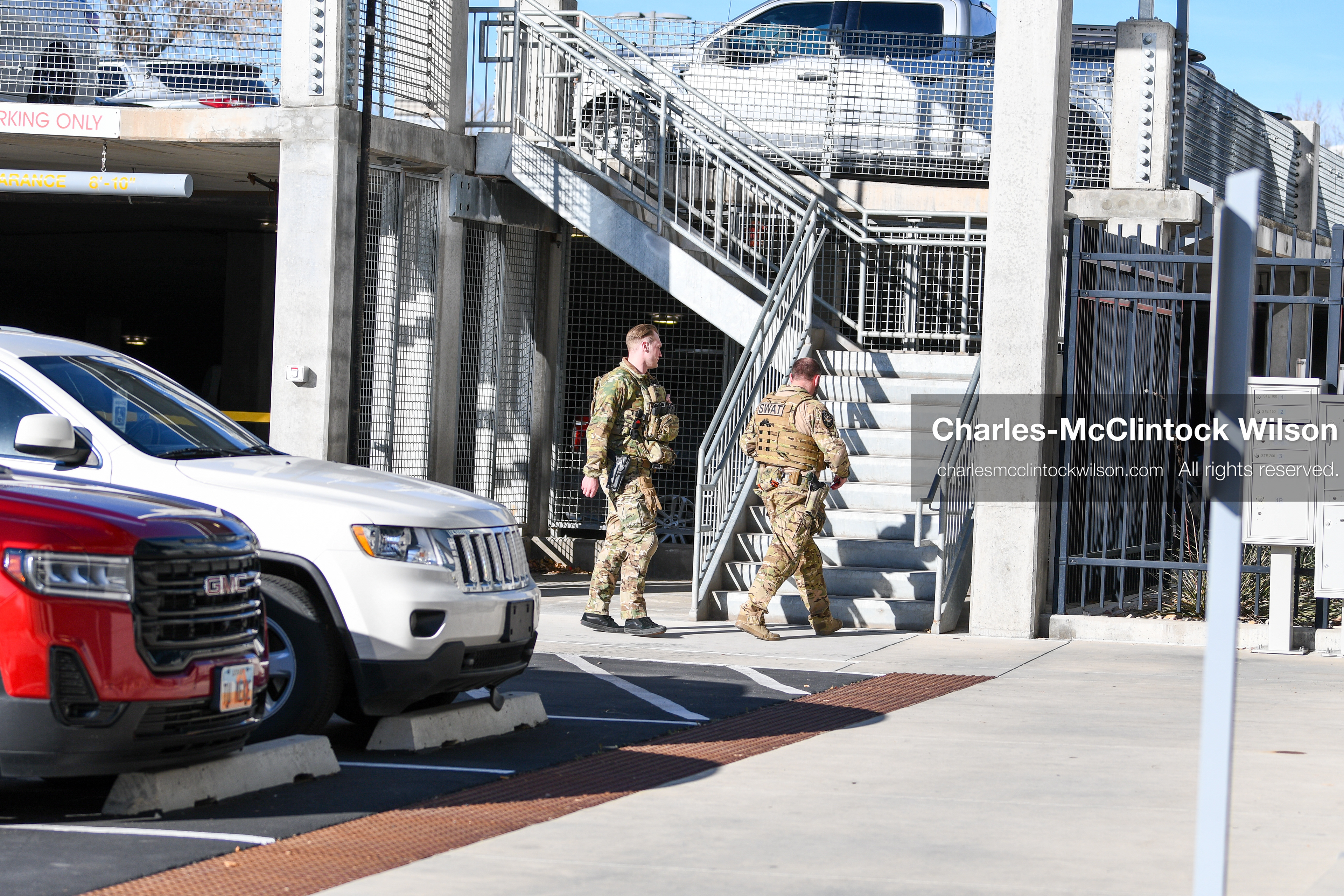 PROVO, UTAH, USA – DECEMBER 11, 2025: Two SWAT members walk near the Fourth District Court in Provo during the first in‑person court appearance of Tyler Robinson in the Charlie Kirk murder case. (Credit Image: © Charles‑McClintock Wilson/ZUMA Press Wire)