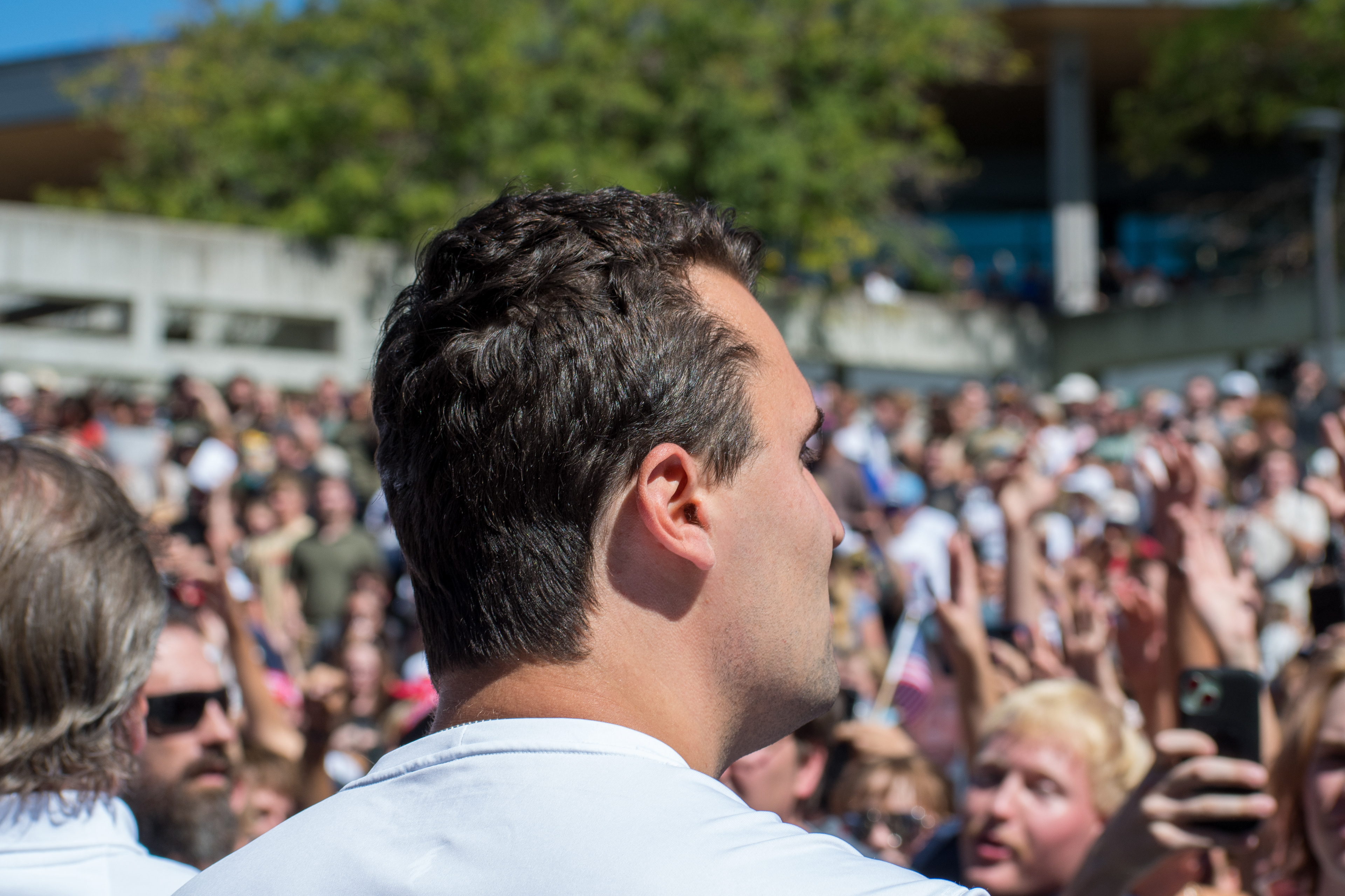 OREM, UTAH – SEPTEMBER 10, 2025: Charlie Kirk stands among supporters during a public event at Utah Valley University. Captured in the foreground as attendees gather around him, Kirk appears engaged and expressive in one of his final public moments. The image reflects the scale and intensity of the crowd’s response, underscoring the civic energy that defined the gathering. © Charles-McClintock Wilson / ZUMA Press