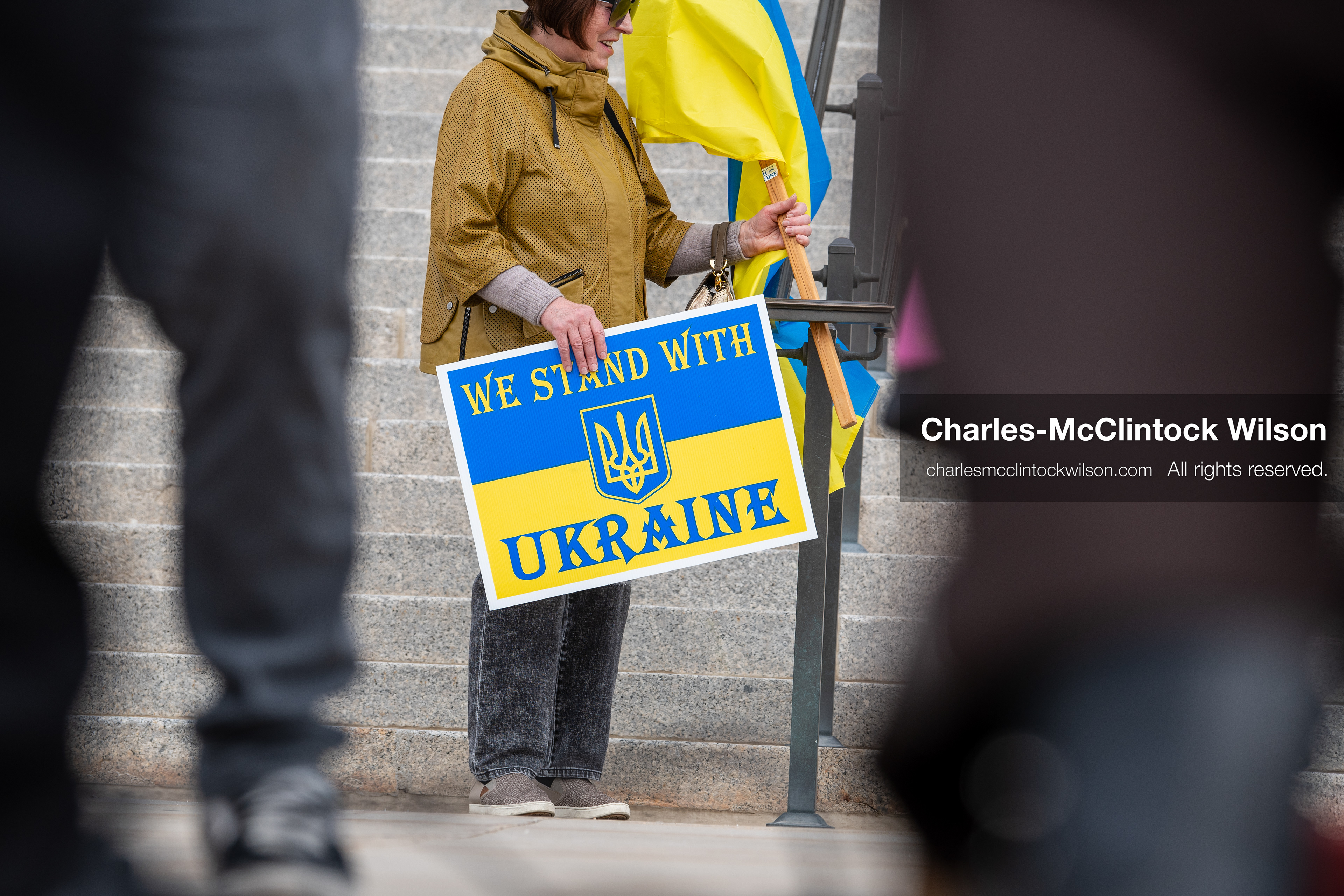February 28, 2026, Salt Lake City, Utah, USA: A demonstrator holds a sign reading We Stand With Ukraine in the colors of the Ukrainian flag during the Stand With Ukraine rally at the Utah State Capitol. The gathering marked the four year anniversary of the full scale Russian invasion of Ukraine and brought community members together in support of Ukrainians and local humanitarian efforts. (Credit Image: © Charles McClintock Wilson/ZUMA Press Wire)