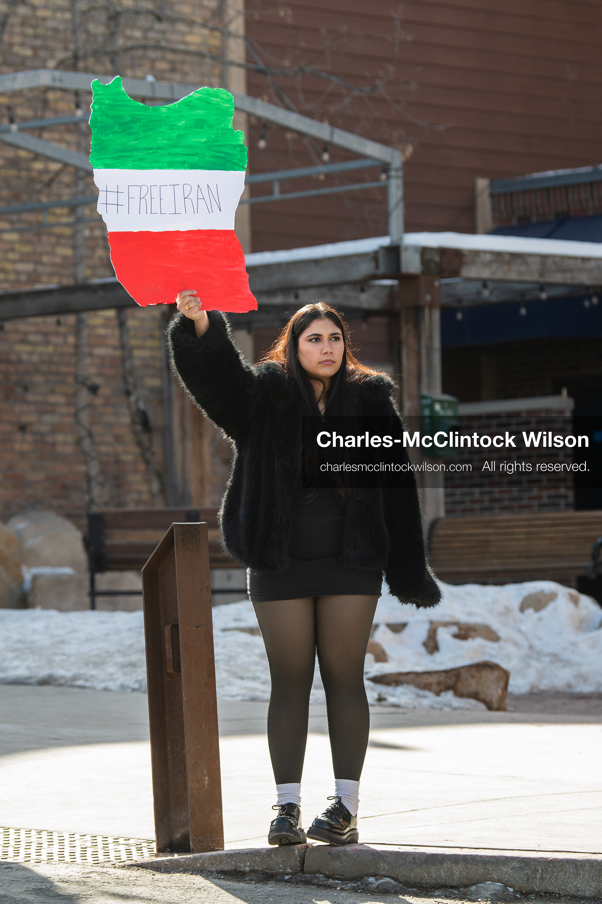 January 30, 2026, Park City, Utah, USA: A demonstrator holds a sign shaped like Iran during a small protest against the Iranian government on Main Street in Park City, Utah. (Credit Image: © Charles McClintock Wilson/ZUMA Press Wire)