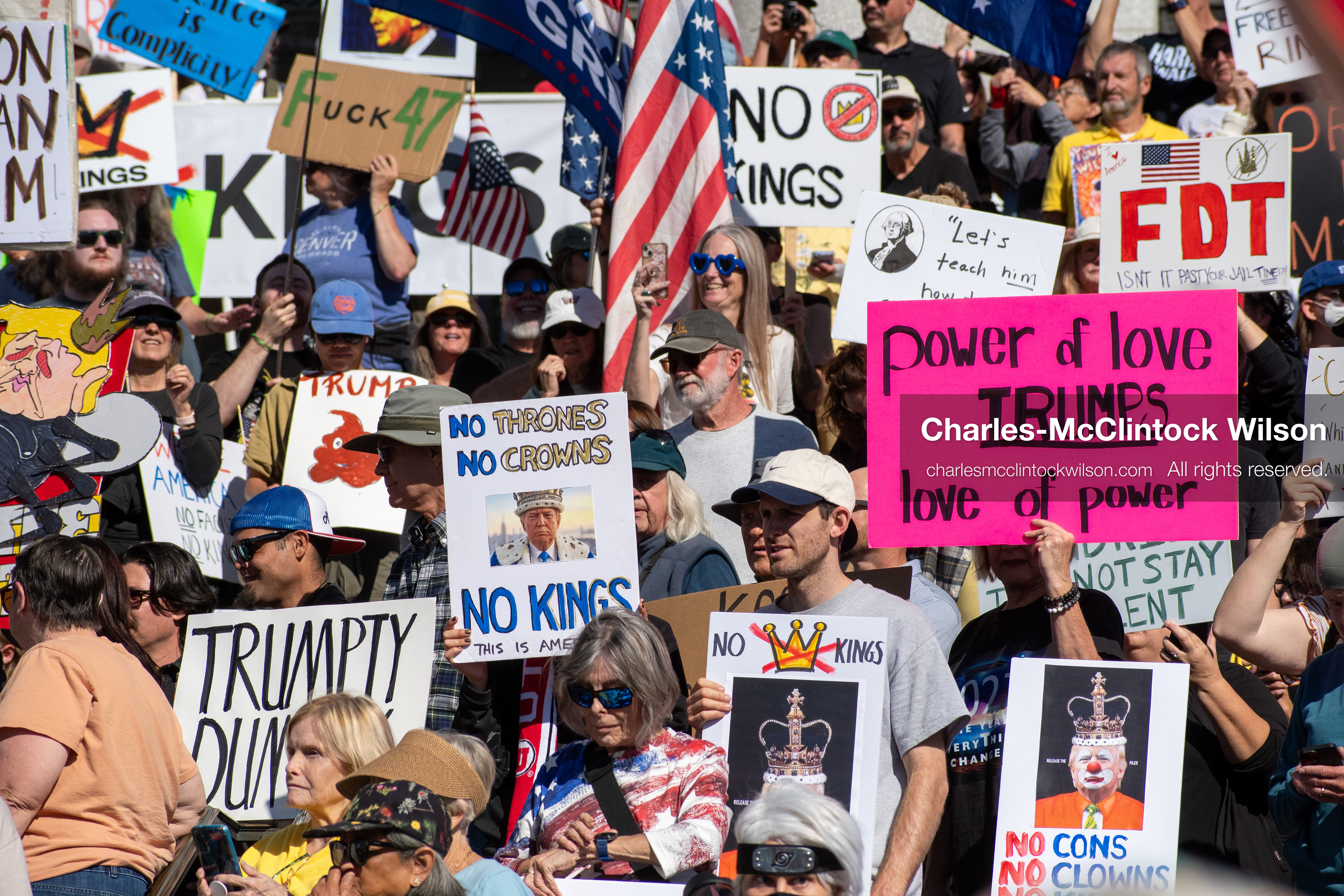 October 18, 2025, Salt Lake City, Utah, USA: Demonstrators participate in a "No Kings" protest held at the Utah State Capitol. Participants hold signs and flags during the public gathering.