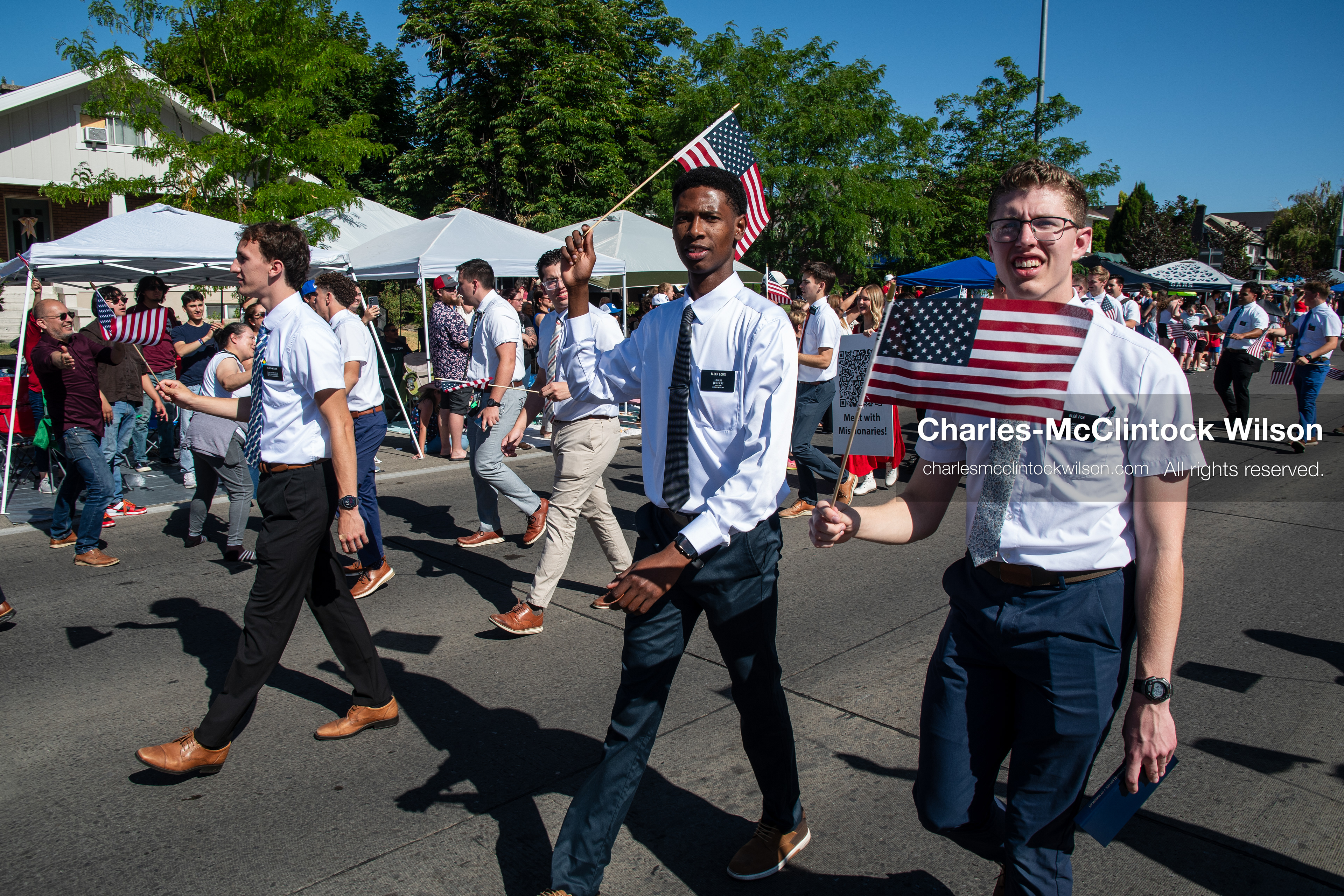 July 4, 2026, Provo, Utah, USA: Missionaries from The Church of Jesus Christ of Latter-day Saints wear black name badges and wave American flags while marching down the street during America's Freedom Festival Grand Parade in Provo, Utah, Saturday, July 4, 2026. The annual Independence Day event features expanded programming to honor the 250th anniversary of United States independence. (Credit Image: © Charles-McClintock Wilson/ZUMA Press Wire)