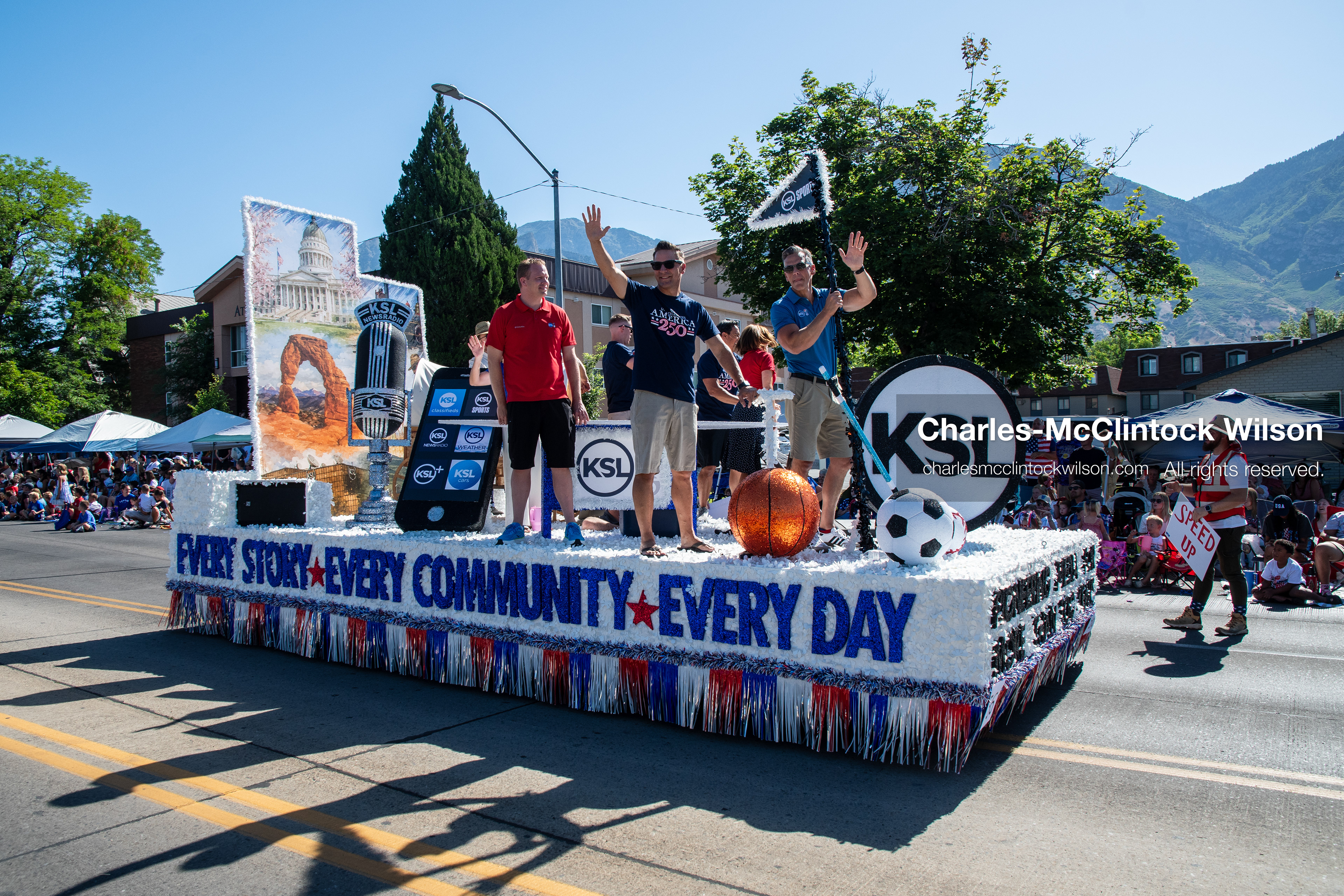 July 4, 2026, Provo, Utah, USA: Representatives from KSL NewsRadio and KSL TV wave to the crowd from a corporate parade float during America's Freedom Festival Grand Parade in Provo, Utah, Saturday, July 4, 2026. The annual Independence Day event features expanded programming to honor the 250th anniversary of United States independence. (Credit Image: © Charles-McClintock Wilson/ZUMA Press Wire)