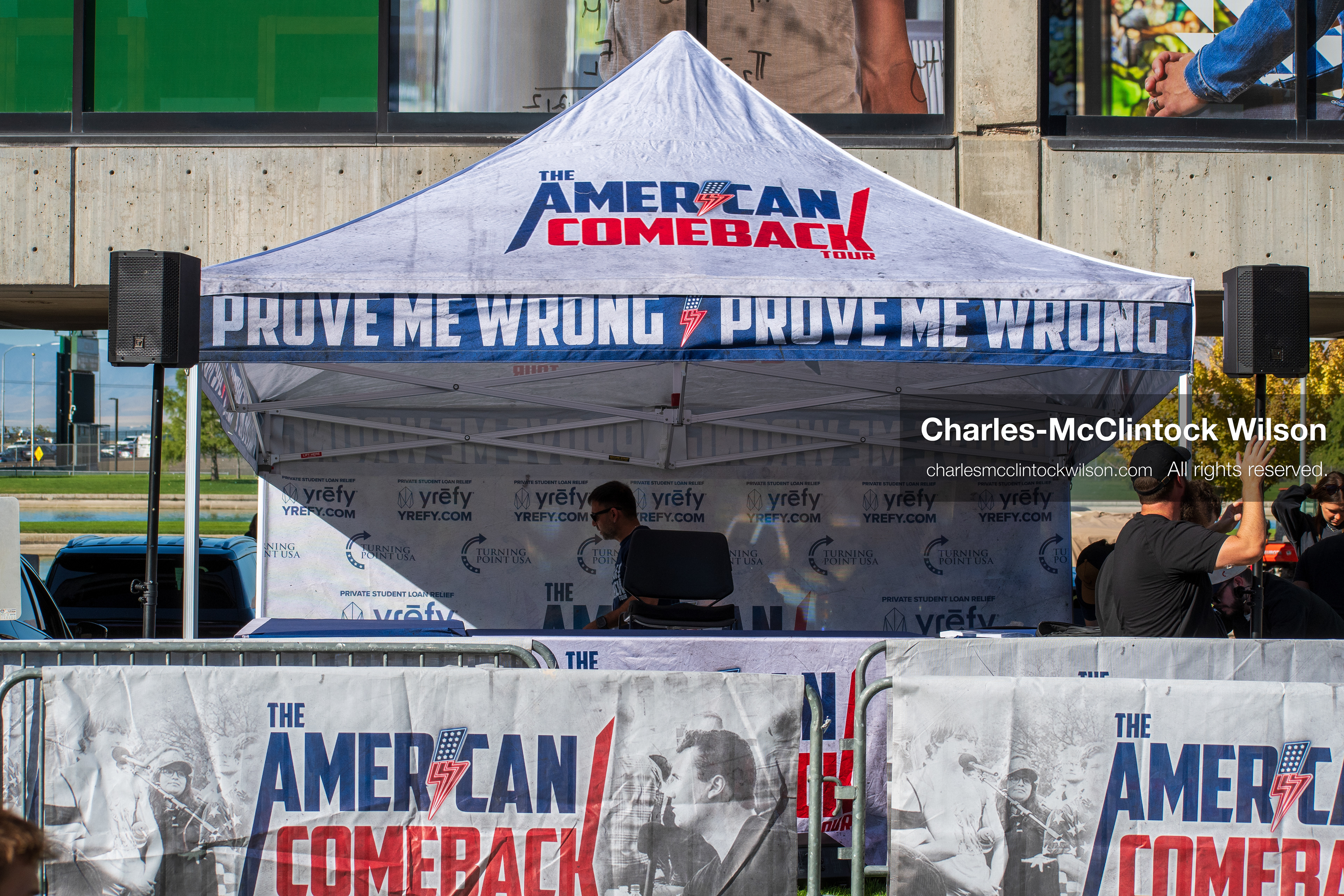 OREM, UTAH – SEPTEMBER 10, 2025: A branded tent stands outside the student center at Utah Valley University during the opening stop of the American Comeback Tour. Featuring bold signage and coordinated barriers, the setup reflects a moment of visual messaging, logistical precision, and public invitation. The image captures the infrastructure and thematic clarity that shaped the event’s atmosphere. © Charles-McClintock Wilson / ZUMA Press