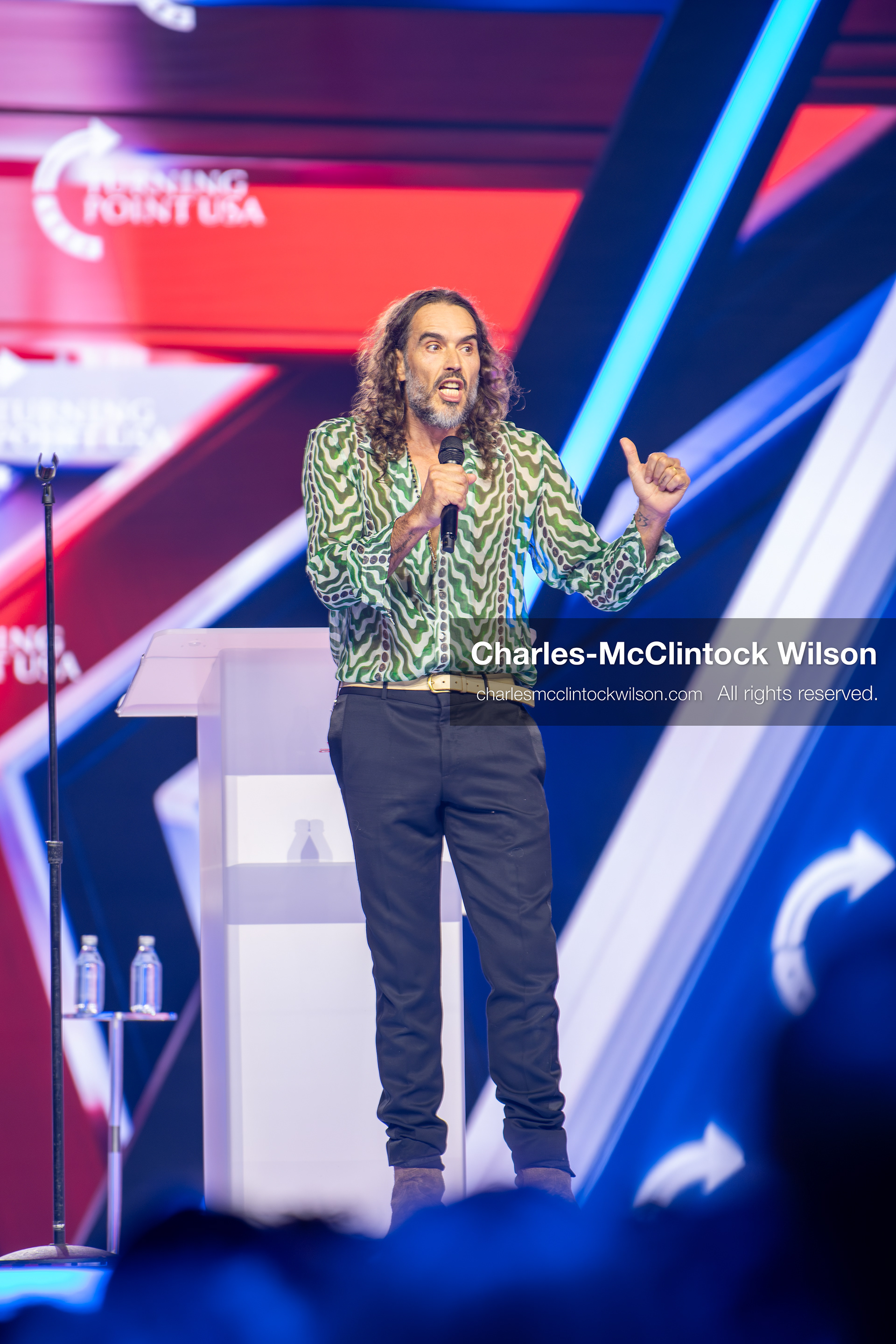 December 18, 2025, Phoenix, Arizona, USA: Russell Brand speaks during Day One of Turning Point USA’s AmericaFest 2025 at the Phoenix Convention Center in Phoenix, Arizona.   (Credit Image: © Charles‑McClintock Wilson/ZUMA Press Wire)