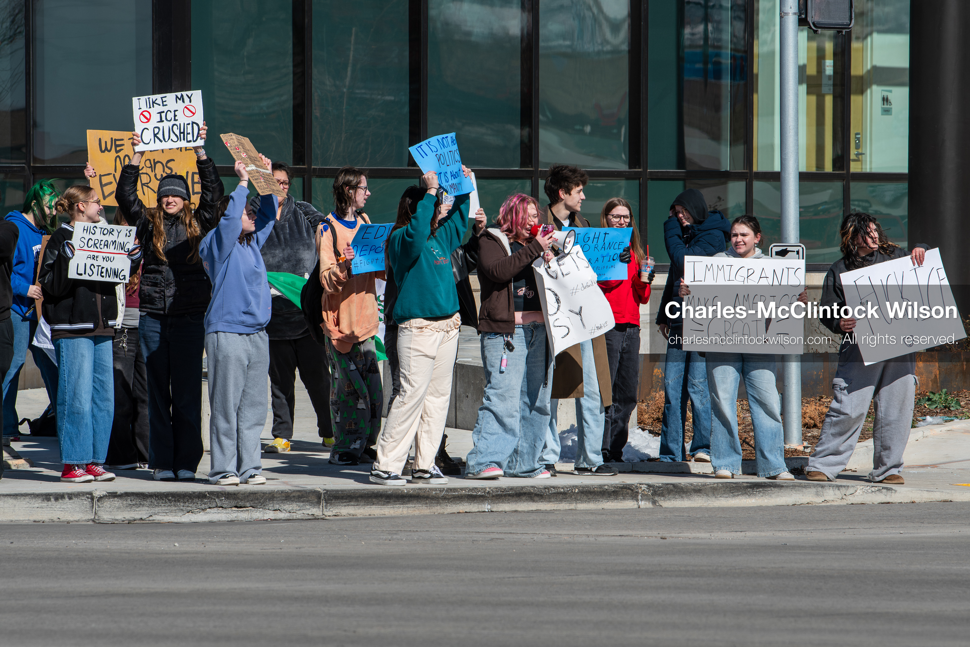 February 20, 2026, Orem, Utah, USA: High school students gather along State Street in front of Orem City Hall during a student led protest against ICE and federal immigration enforcement. Demonstrators hold signs as they stand near the roadway while traffic continues through the area. (Credit Image: © Charles McClintock Wilson/ZUMA Press Wire)
