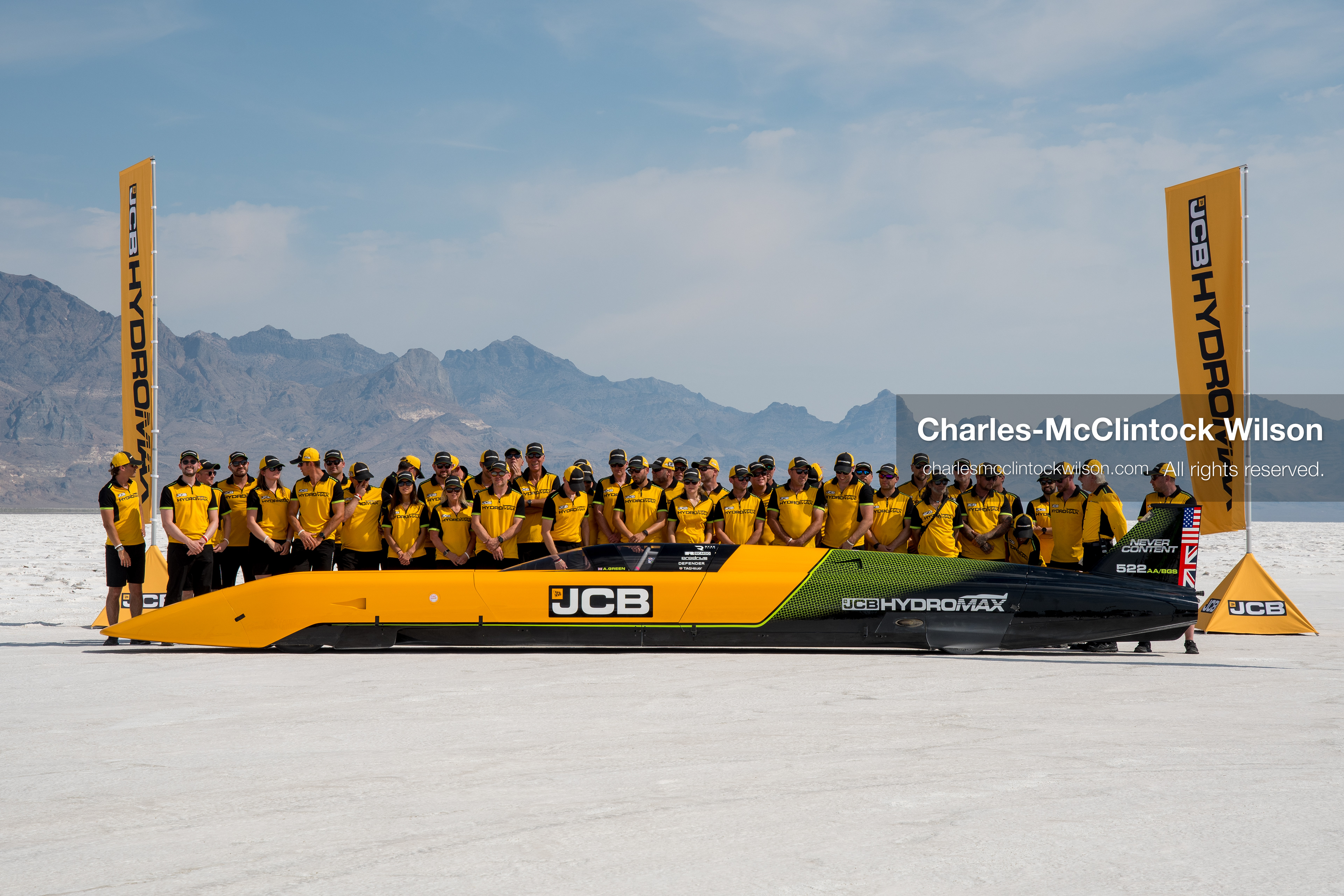 August 11, 2026, Wendover, Utah, USA: British pilot Andy Green and the JCB engineering team pose for a group photo behind the ''JCB Hydromax'' hydrogen-powered streamliner on the Bonneville Salt Flats on Tuesday. The team celebrated setting a new land speed record for a hydrogen vehicle, reaching a top speed of 406.320 mph. (Credit Image: © Charles McClintock Wilson/ZUMA Press Wire)