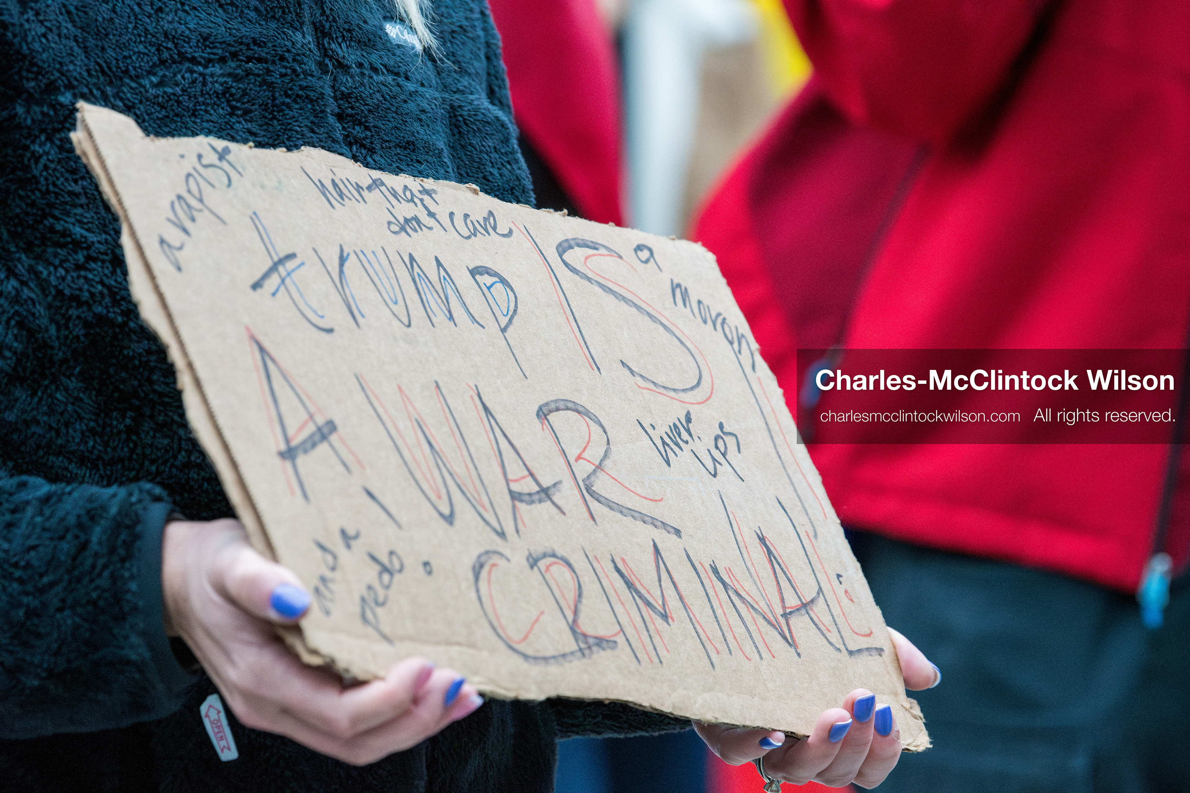January 3, 2026, Salt Lake City, Utah, USA: A protester holds a sign during a demonstration against US action in Venezuela outside the Wallace Federal Building in Salt Lake City, Utah. The protest was part of a nationwide mobilization responding to recent military developments. (Credit Image: (c) Charles‑McClintock Wilson/ZUMA Press Wire)