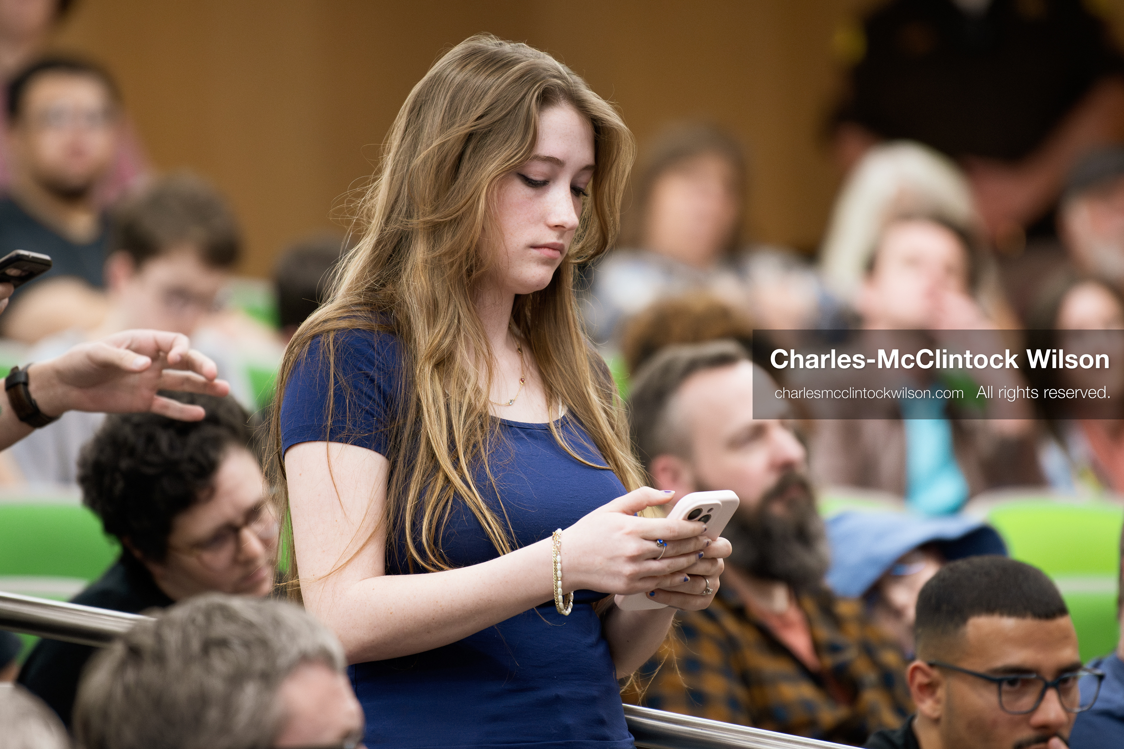 March 26, 2026, Orem, Utah, USA: An attendee looks at a phone while standing among the audience during Frank Turek’s “Change My Mind” College Tour event at Utah Valley University in Orem, Utah. (Credit Image: © Charles-McClintock Wilson/ZUMA Press Wire)