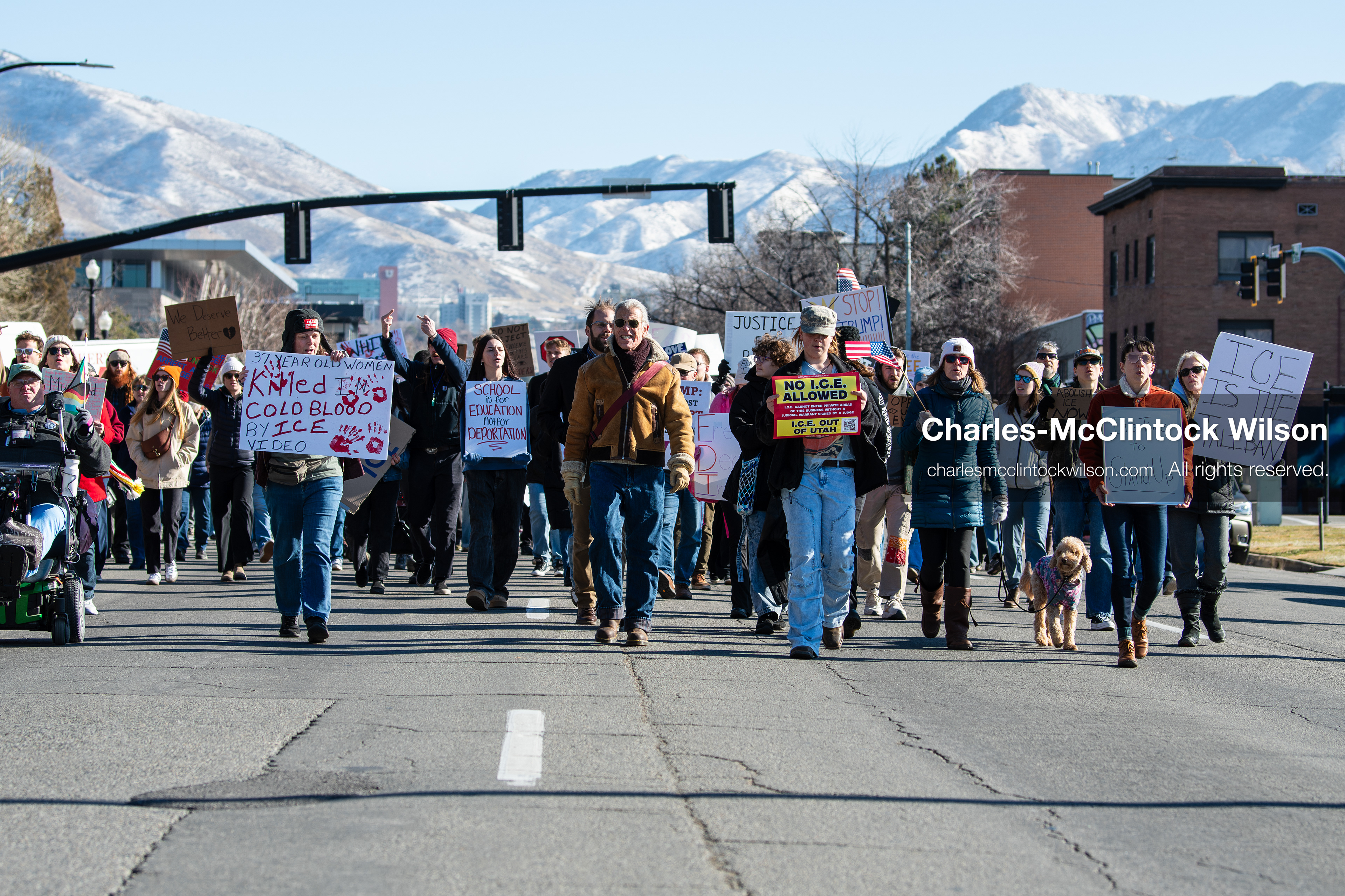 Salt Lake City, Utah, January 10, 2026: A group of demonstrators marches through downtown Salt Lake City during the ICE Out for Good protest, which began at Washington Square Park, with participants carrying signs and personal items as they walk together. (Credit Image: © Charles‑McClintock Wilson/ZUMA Press Wire)