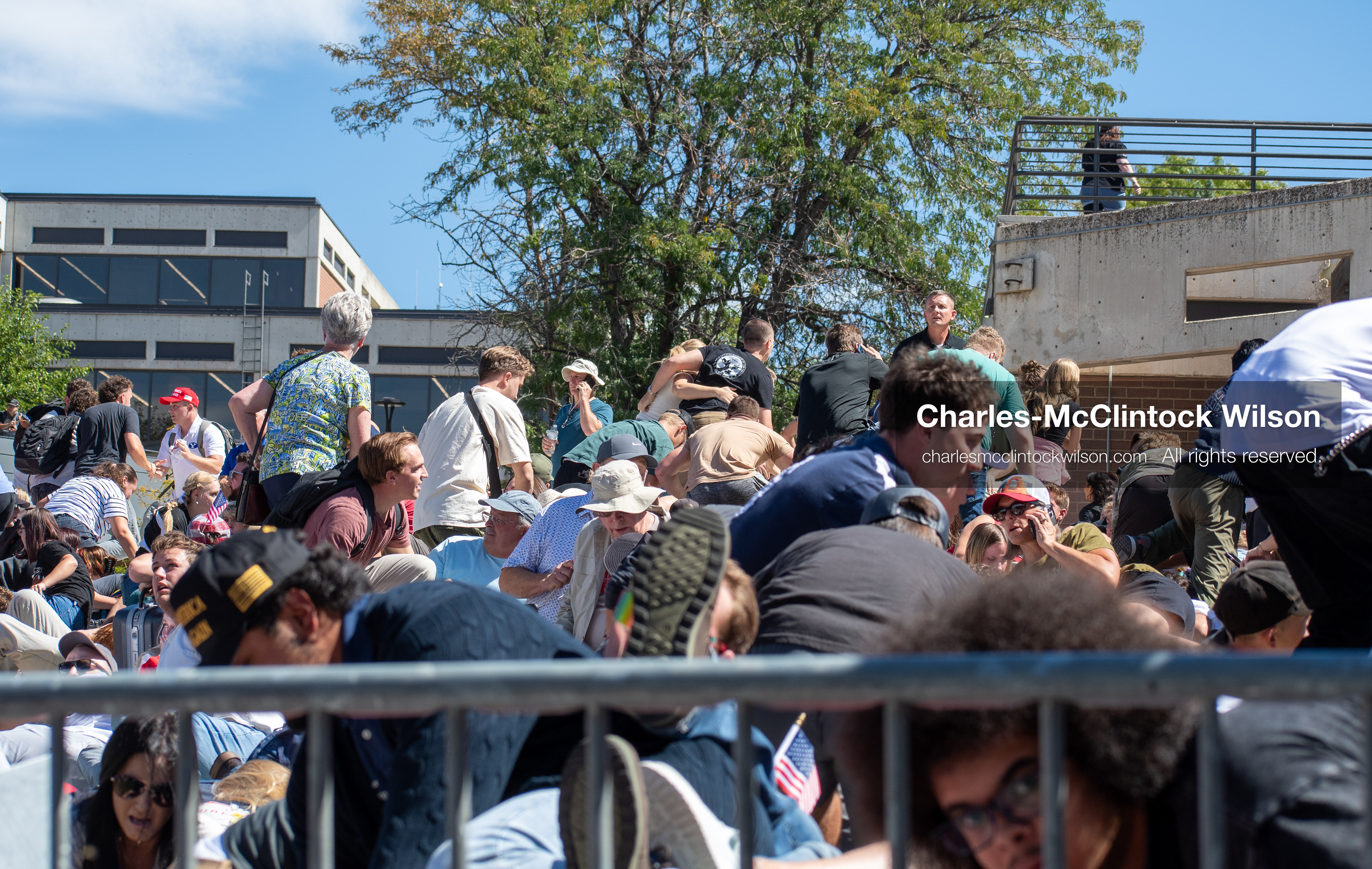 September 10, 2025, Orem, Utah, USA: Attendees duck for cover moments after a gunshot is fired during a public event at Utah Valley University, where conservative activist Charlie Kirk is shot during a Q&A session with students. The shooting prompts immediate panic and a rapid evacuation as law enforcement begins securing the area. (Credit Image: © Charles-McClintock Wilson/ZUMA Press Wire)