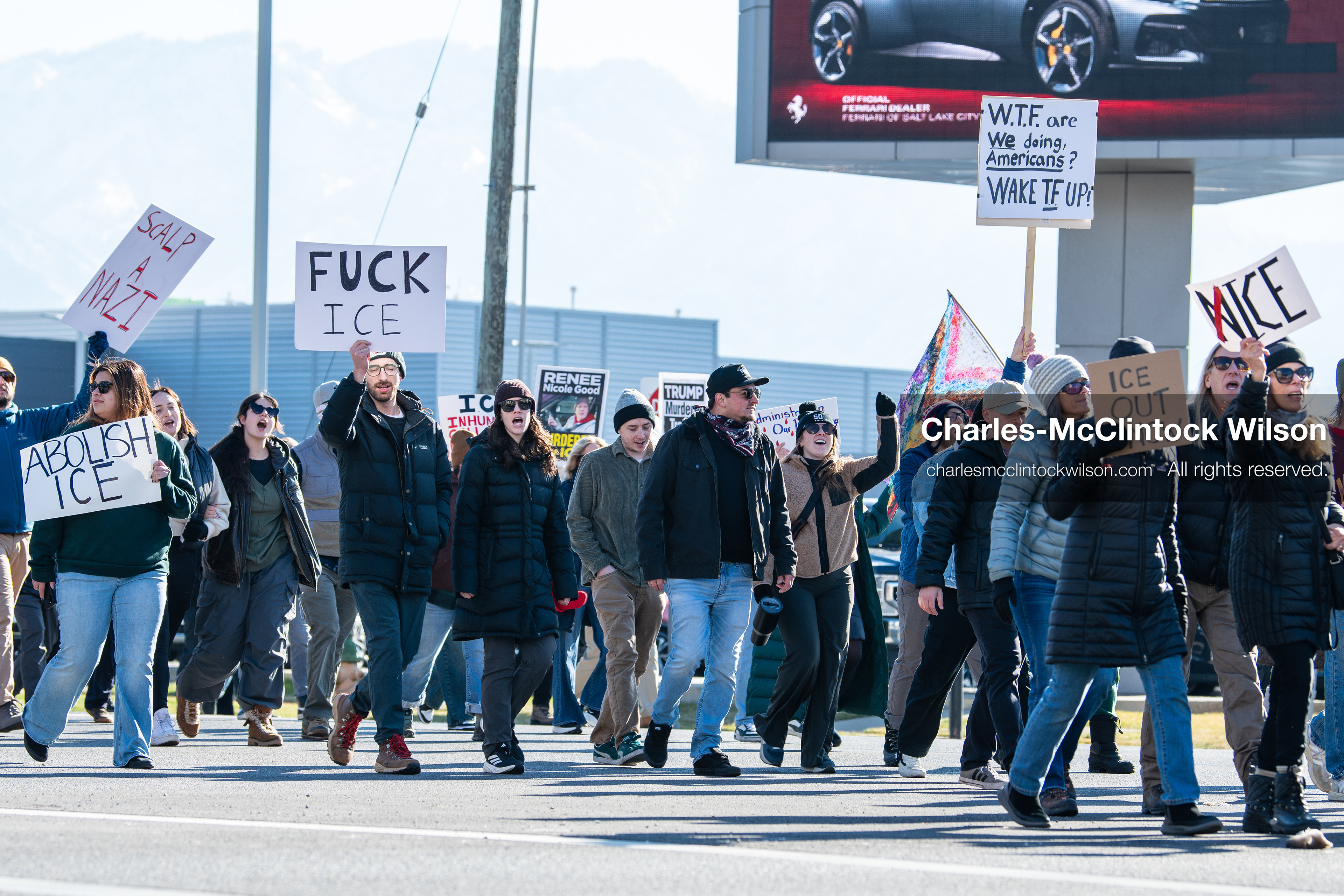 Salt Lake City, Utah, January 10, 2026: A group of demonstrators marches through downtown Salt Lake City during the ICE Out for Good protest, which began at Washington Square Park, with participants carrying signs and personal items as they walk together. (Credit Image: © Charles‑McClintock Wilson/ZUMA Press Wire)