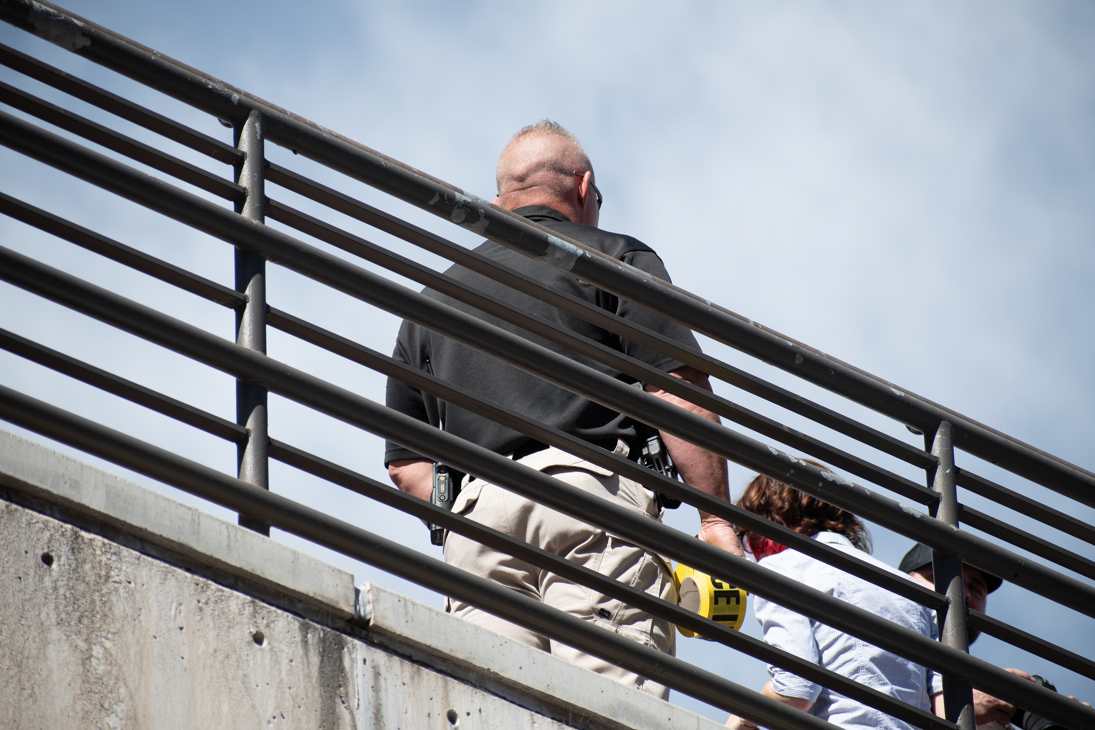 September 10, 2025 – Orem, Utah, United States: A Utah Valley University police officer maintains a security post on an elevated walkway ahead of a scheduled public event featuring conservative activist Charlie Kirk. Photograph by Charles‑McClintock Wilson / ZUMA Press Wire 