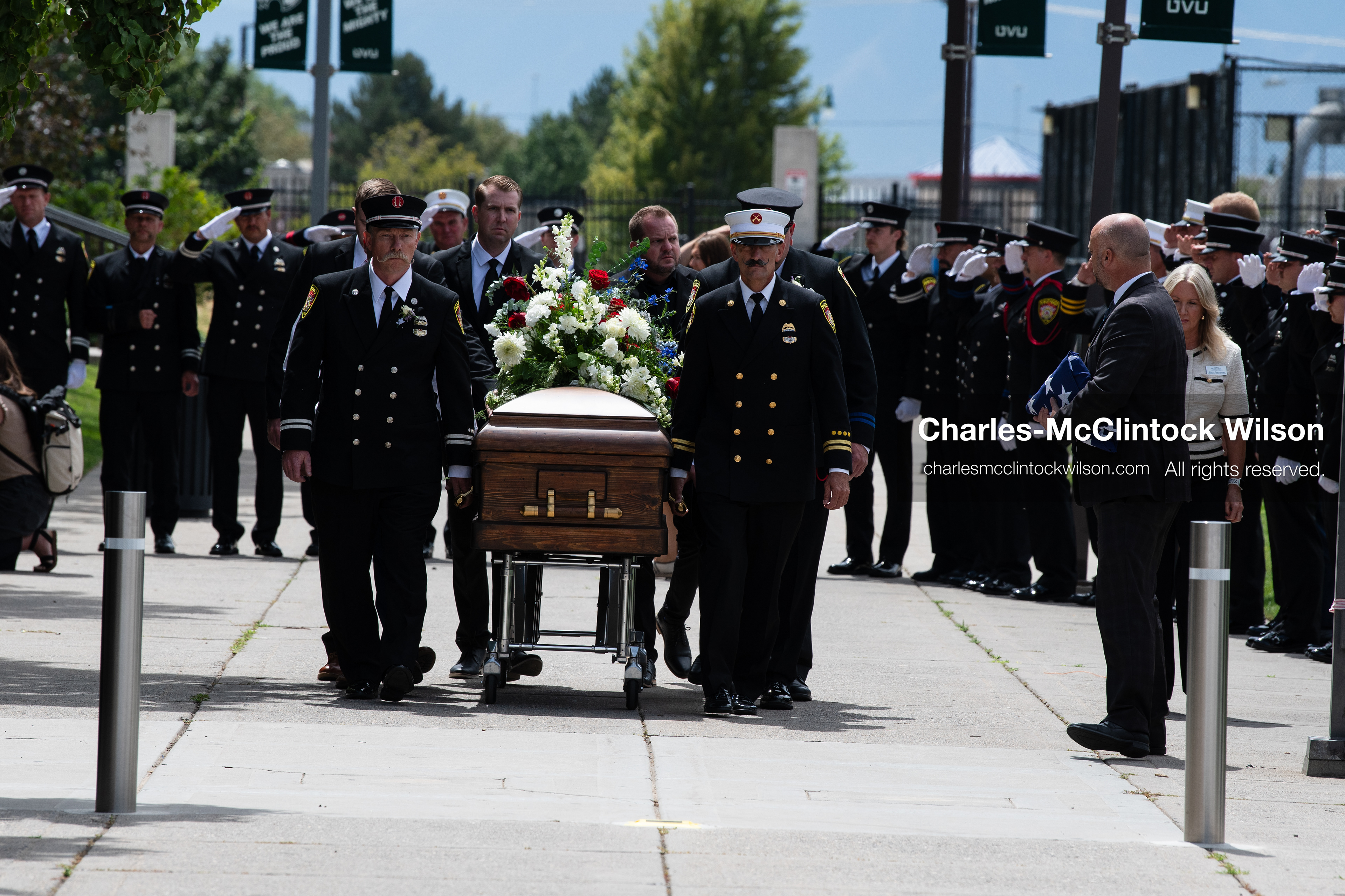 Firefighters and pallbearers escort the casket of Provo Fire Captain Spencer Long outside the UCCU Center on the campus of Utah Valley University in Orem, Utah, on Wednesday, July 29, 2026. More than 300 people came to the public memorial ceremony to honor Captain Long, his wife Katrina, and three of their sons, who died after a flash flood hit their campsite near the Sunglow Campground in Wayne County. (Photo by Charles-McClintock Wilson/Sipa USA)