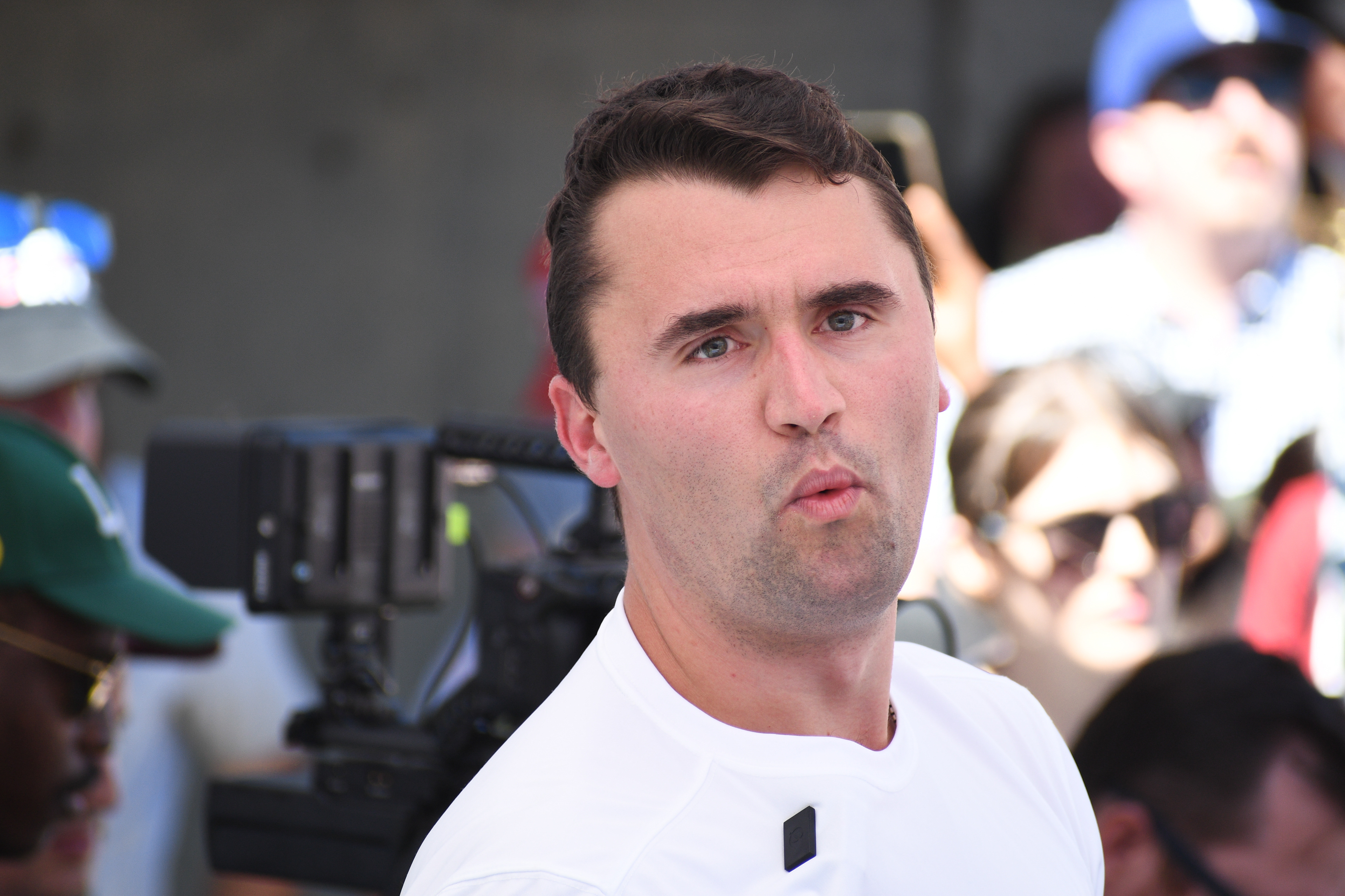 OREM, UTAH – SEPTEMBER 10, 2025: Charlie Kirk reacts during a public appearance at Utah Valley University, where he addressed supporters and engaged with attendees in the UVU Courtyard. Captured mid-expression, Kirk looks directly at the camera as media crews and onlookers gather around him. The image reflects the immediacy and intensity of his final public engagement before the shooting incident that disrupted the event. © Charles-McClintock Wilson / ZUMA Press