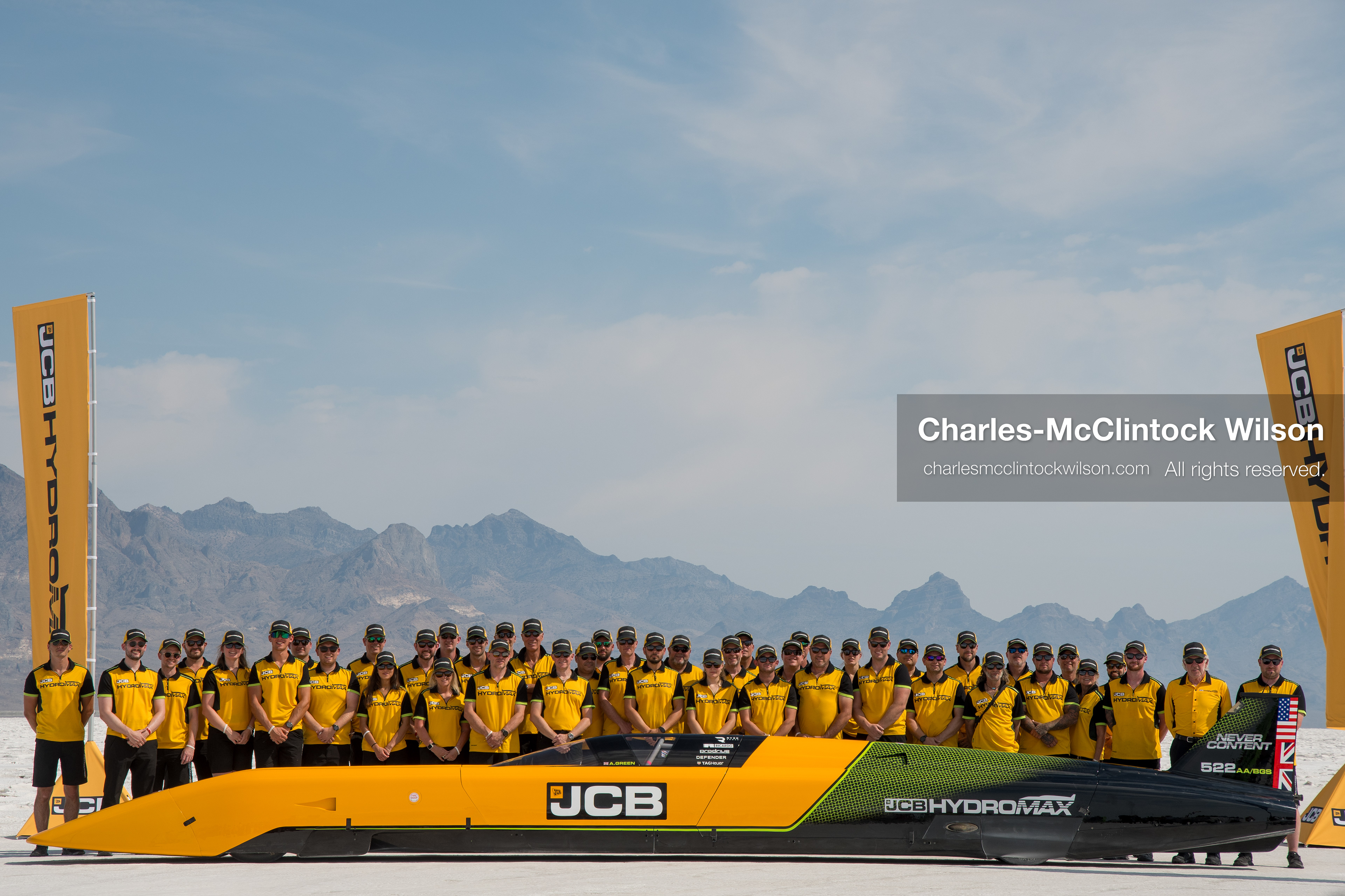 August 11, 2026, Wendover, Utah, USA: British pilot Andy Green and the JCB engineering team pose for a group photo behind the ''JCB Hydromax'' hydrogen-powered streamliner on the Bonneville Salt Flats on Tuesday. The team celebrated setting a new land speed record for a hydrogen vehicle, reaching a top speed of 406.320 mph. (Credit Image: © Charles McClintock Wilson/ZUMA Press Wire)