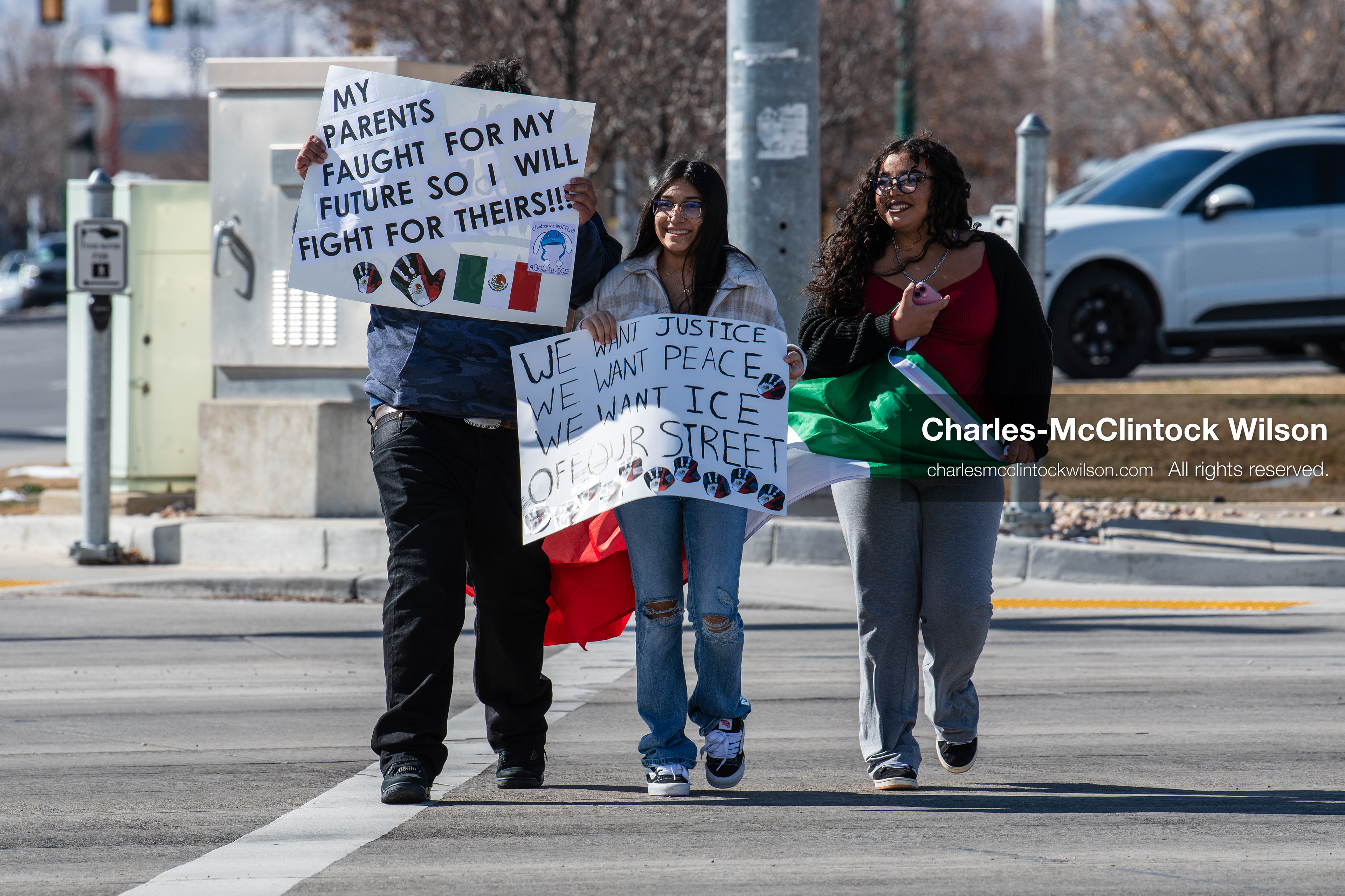 February 20, 2026, Orem, Utah, USA: Participants cross State Street in front of Orem City Hall during a student led protest against ICE. Demonstrators move through the crosswalk as vehicles wait in the area. (Credit Image: © Charles McClintock Wilson/ZUMA Press Wire)