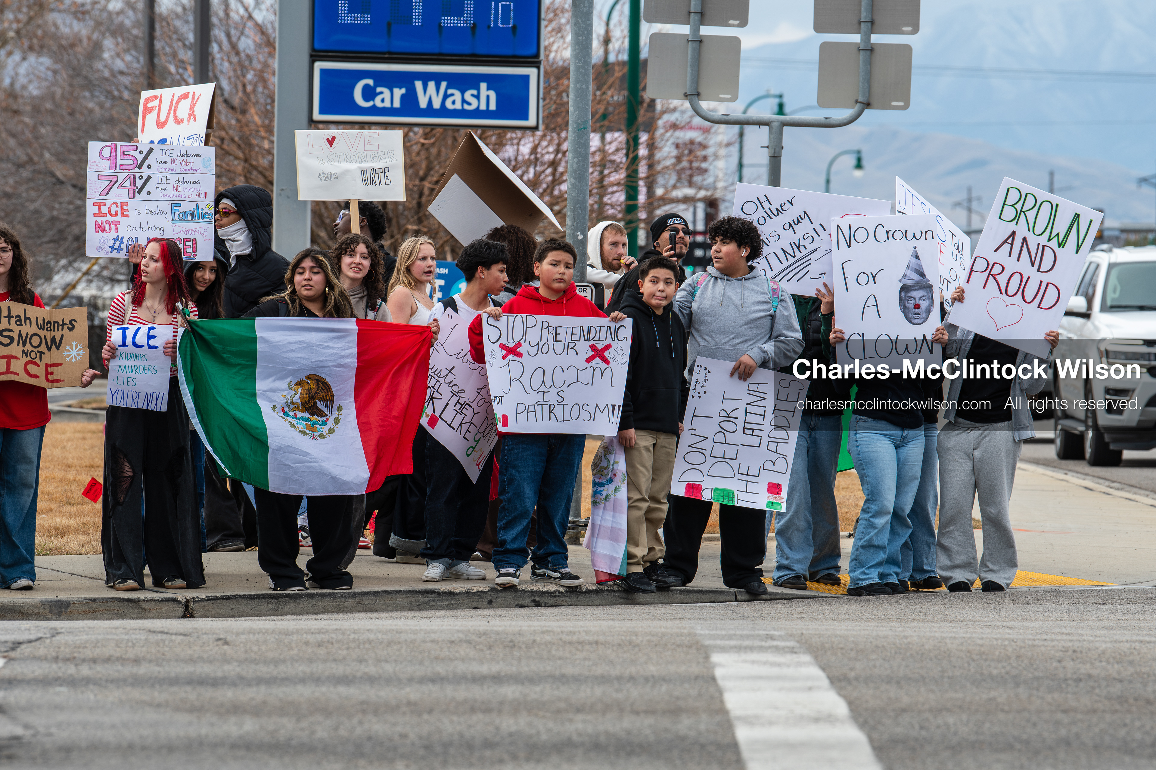 February 11, 2026, Orem, Utah, USA: Students stand on the sidewalk along State Street during a student‑led protest involving participants from multiple Orem schools. (Credit Image: © Charles‑McClintock Wilson/ZUMA Press Wire)