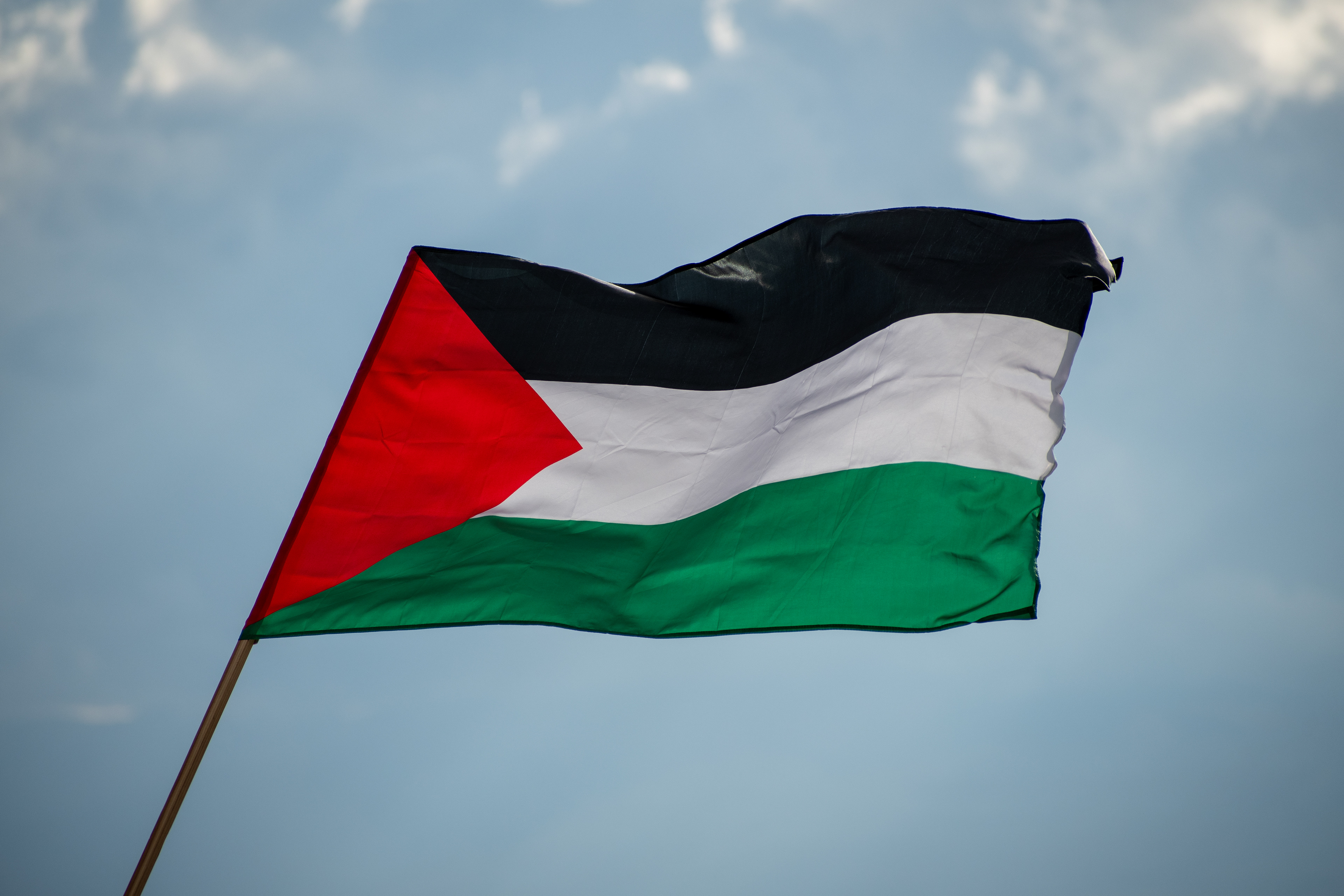 October 10, 2025, Salt Lake City, Utah, USA: A Palestinian flag waves against a cloudy sky during the Free Palestine Rally organized in front of the Utah State Capitol. The flags colors, black, white, green, and red, frame the scene with symbolic clarity. (Credit Image: © Charles-McClintock Wilson/ZUMA Press Wire)