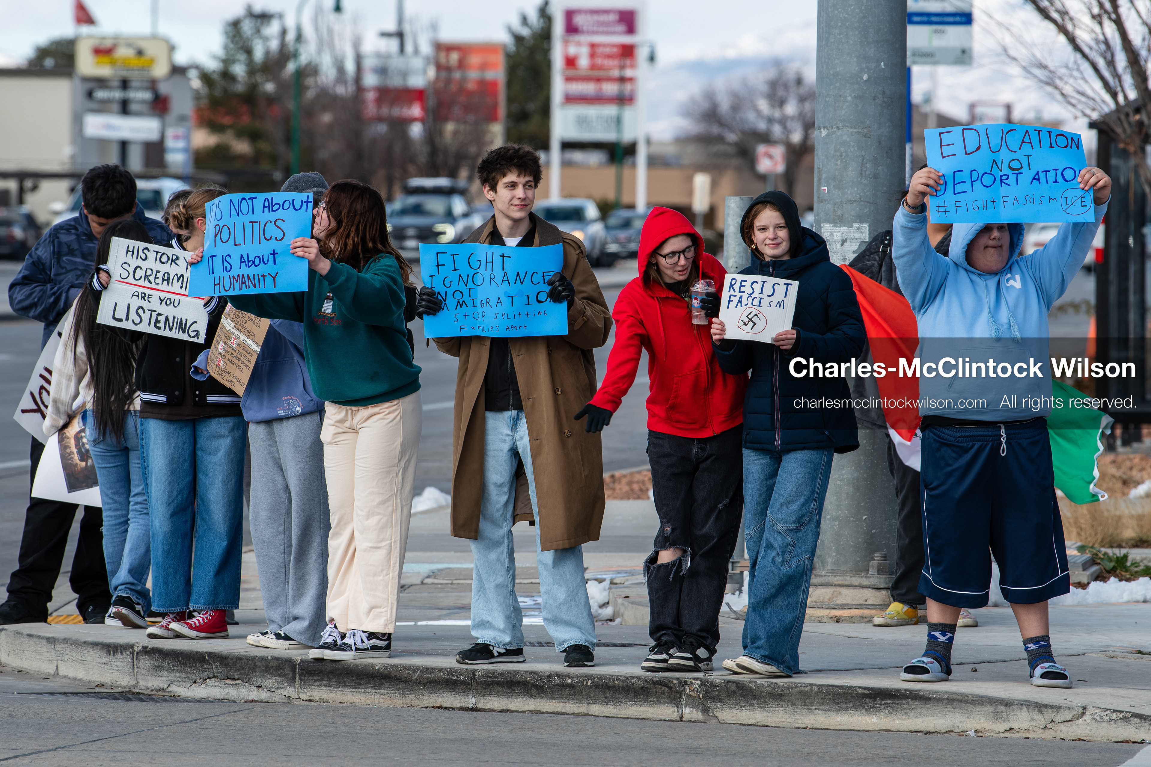 February 20, 2026, Orem, Utah, USA: High school students gather along State Street in front of Orem City Hall during a student led protest against ICE and federal immigration enforcement. Demonstrators hold signs as they stand near the roadway while traffic continues through the area. (Credit Image: © Charles McClintock Wilson/ZUMA Press Wire)