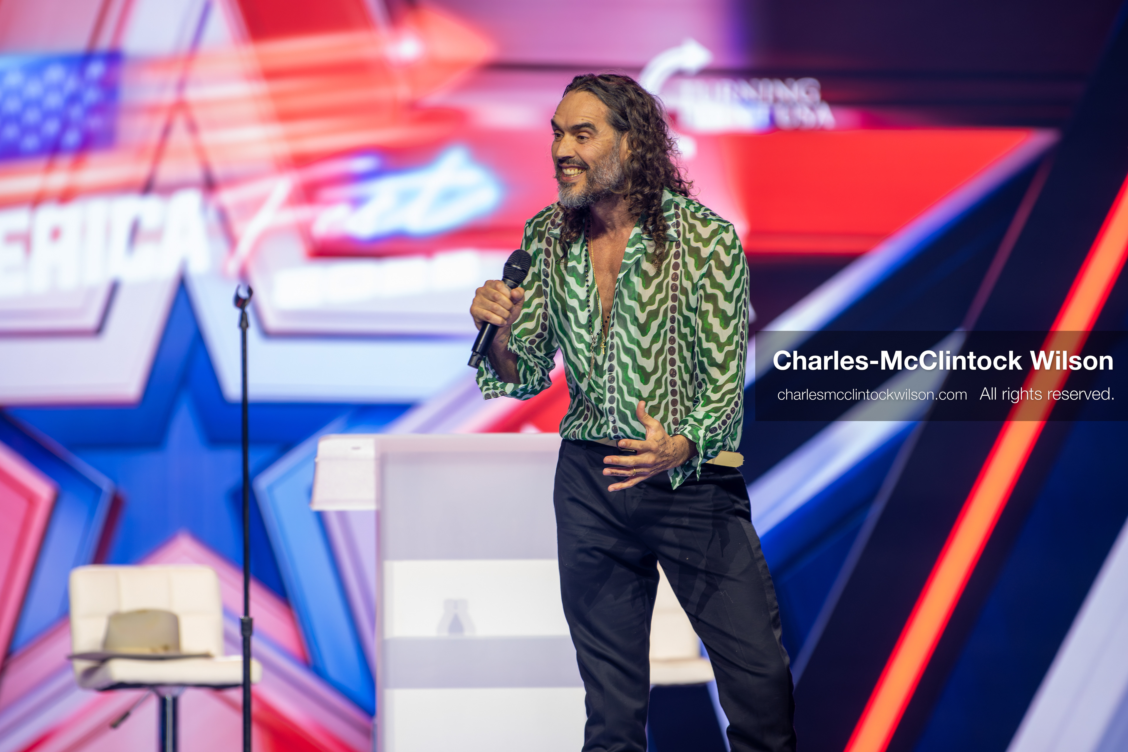 December 18, 2025, Phoenix, Arizona, USA: Russell Brand speaks during Day One of Turning Point USA’s AmericaFest 2025 at the Phoenix Convention Center in Phoenix, Arizona.   (Credit Image: © Charles‑McClintock Wilson/ZUMA Press Wire)