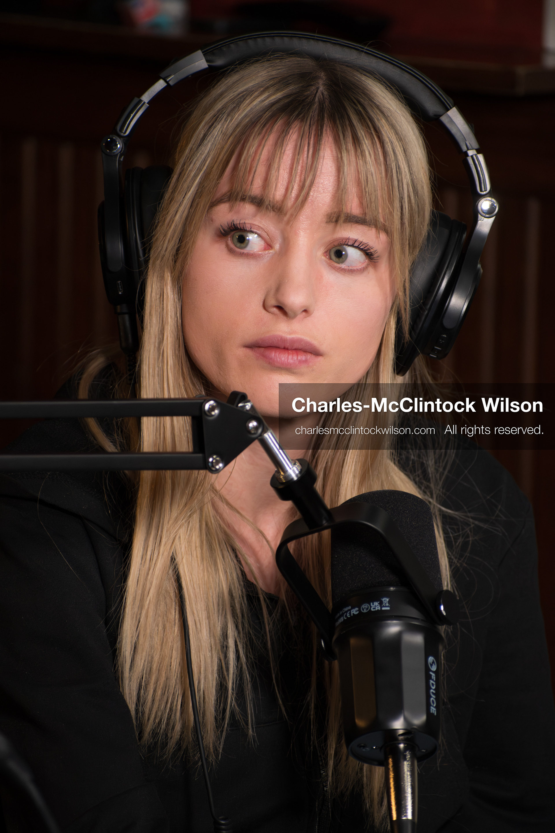 November 22, 2025 – Salt Lake City, Utah, USA: Billie Webb looks toward co-host Brandi Siciliani during the recording of an episode of The Brandi & Billie Show, an independent podcast known for its long-form commentary on politics, culture, and major world events. (Credit Image: © Charles‑McClintock Wilson)
