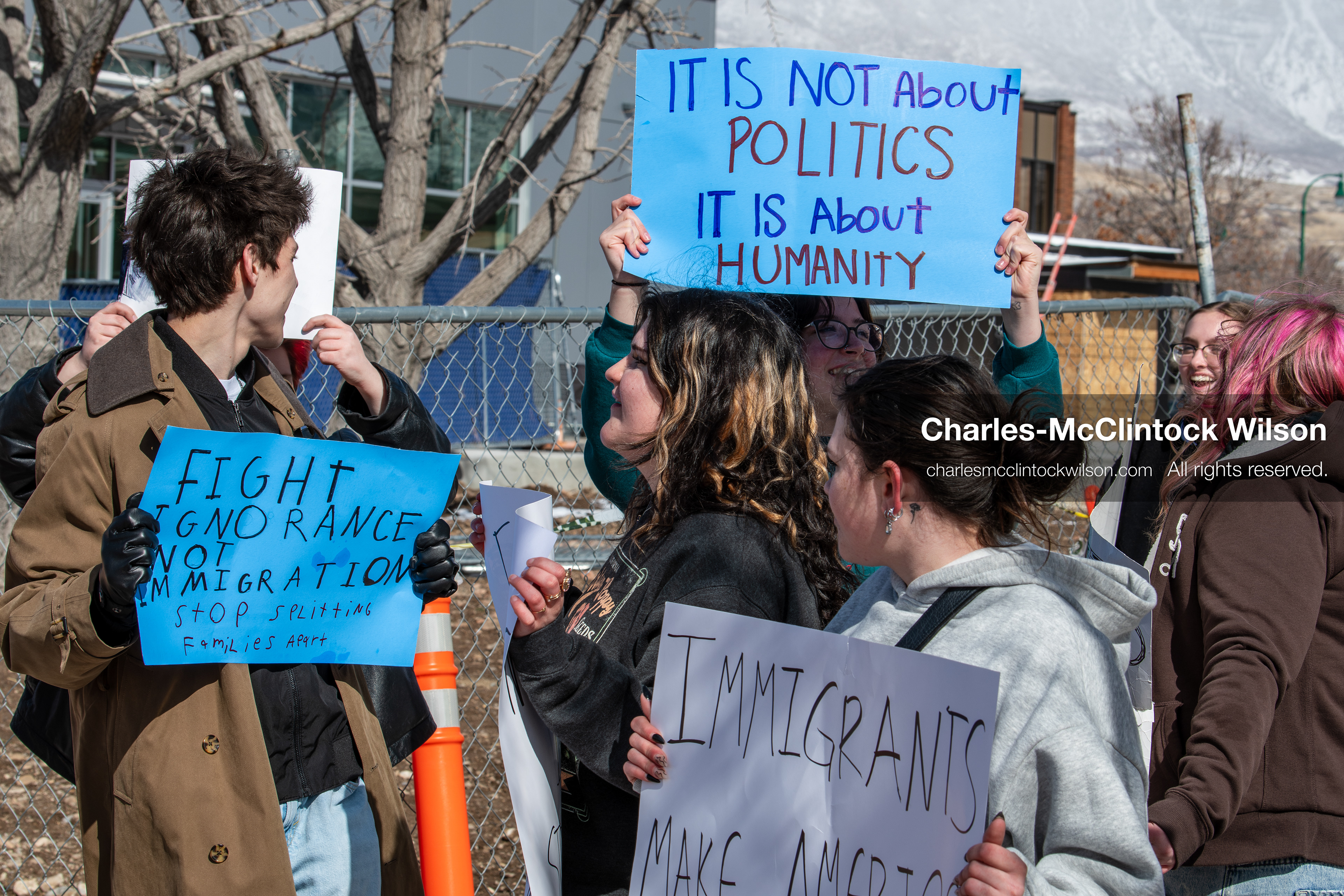 February 20, 2026, Orem, Utah, USA: High school students gather along State Street in front of Orem City Hall during a student led protest against ICE and federal immigration enforcement. Demonstrators hold signs as they stand near the roadway while traffic continues through the area. (Credit Image: © Charles McClintock Wilson/ZUMA Press Wire)