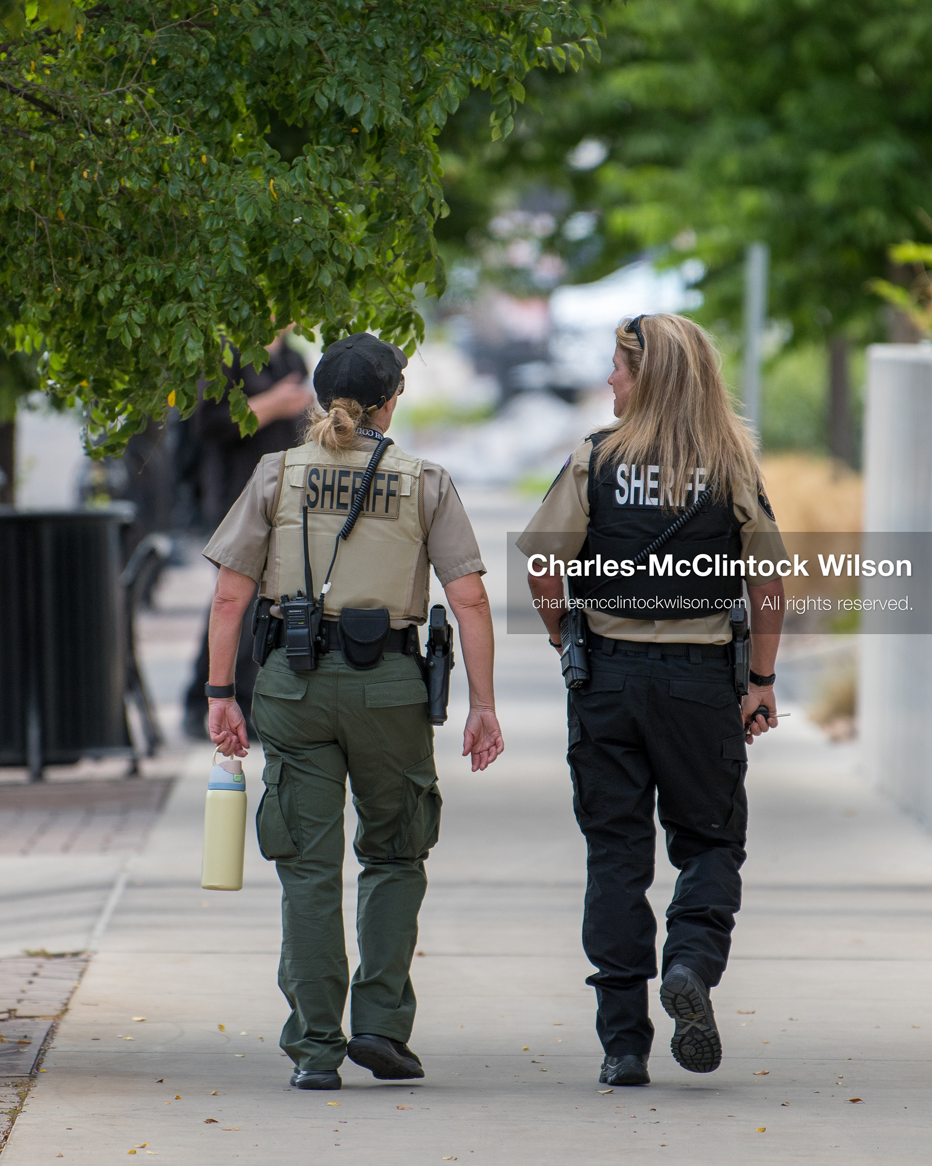 July 6, 2026, Provo, Utah, USA: Two Utah County Sheriff's deputies walk along the sidewalk outside the Fourth District Court in Provo during the preliminary hearing in the Tyler Robinson case. Prosecutors are presenting evidence to determine whether probable cause exists for the case to proceed to trial after Charlie Kirk was fatally shot at Utah Valley University in 2025. (Credit Image: © Charles-McClintock Wilson/ZUMA Press Wire)