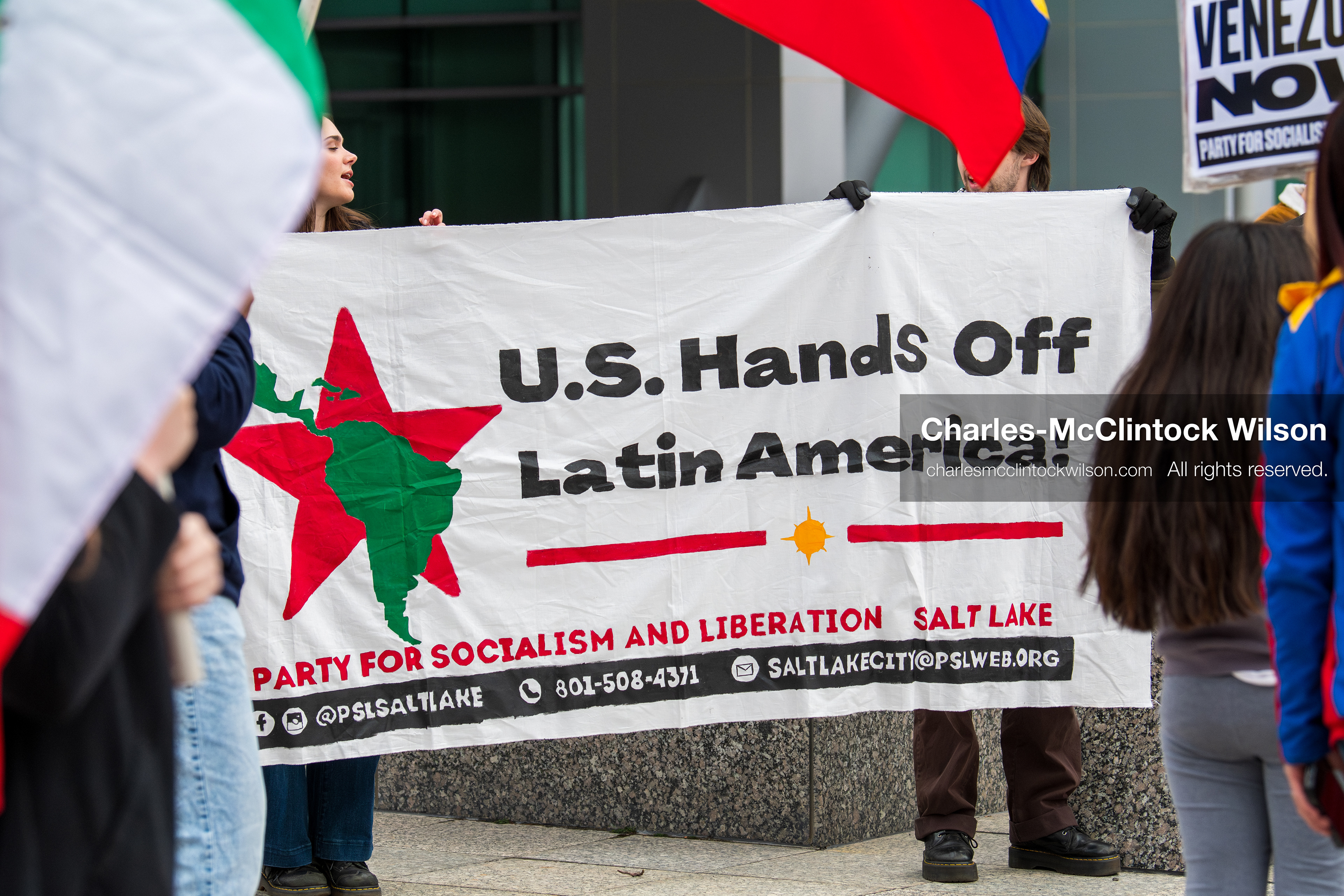 January 3, 2026, Salt Lake City, Utah, USA: Protesters display a banner during a demonstration against US action in Venezuela outside the Wallace Federal Building in Salt Lake City, Utah. The protest was part of a nationwide mobilization responding to recent military developments. (Credit Image: (c) Charles‑McClintock Wilson/ZUMA Press Wire)