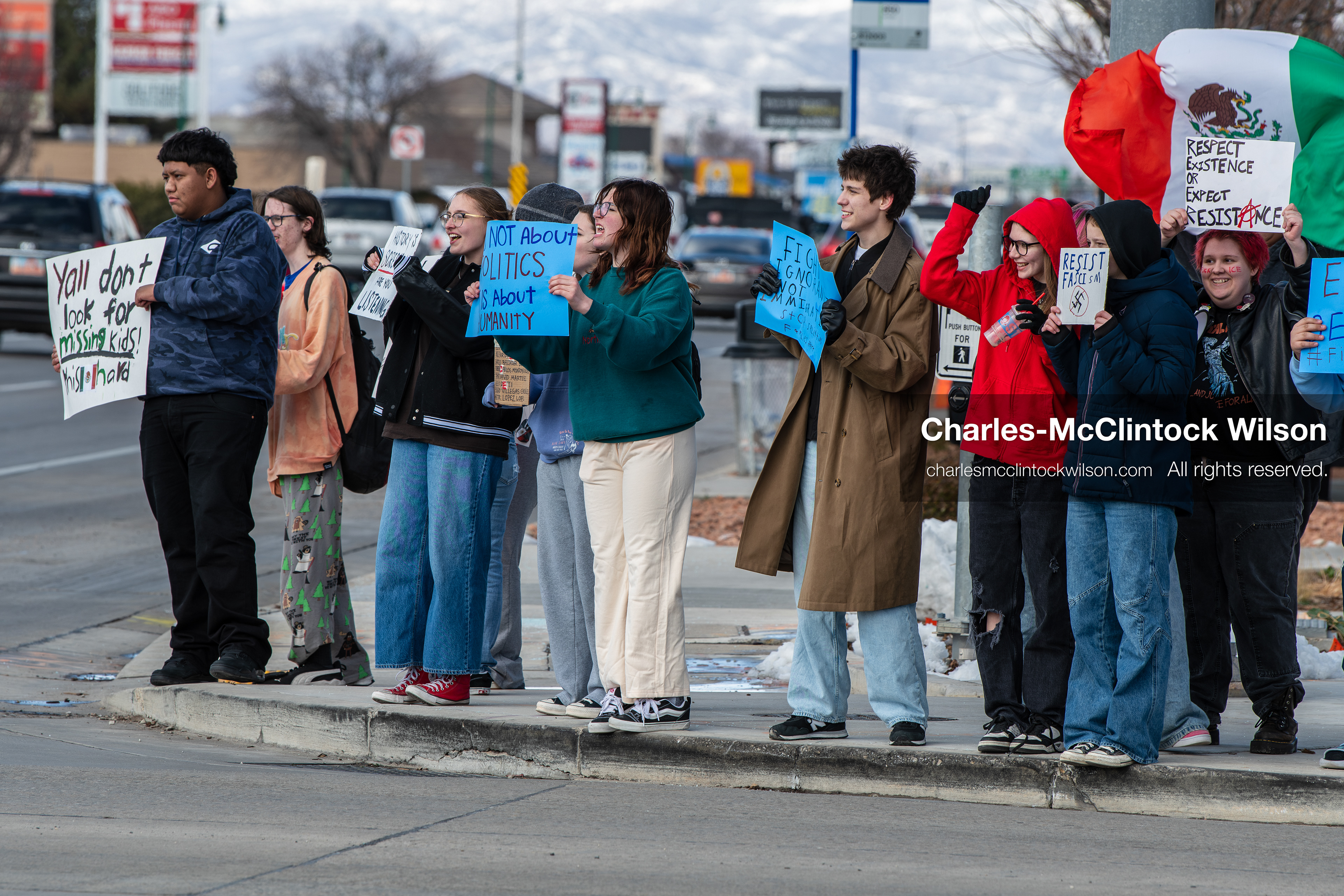 February 20, 2026, Orem, Utah, USA: High school students gather along State Street in front of Orem City Hall during a student led protest against ICE and federal immigration enforcement. Demonstrators hold signs as they stand near the roadway while traffic continues through the area. (Credit Image: © Charles McClintock Wilson/ZUMA Press Wire)