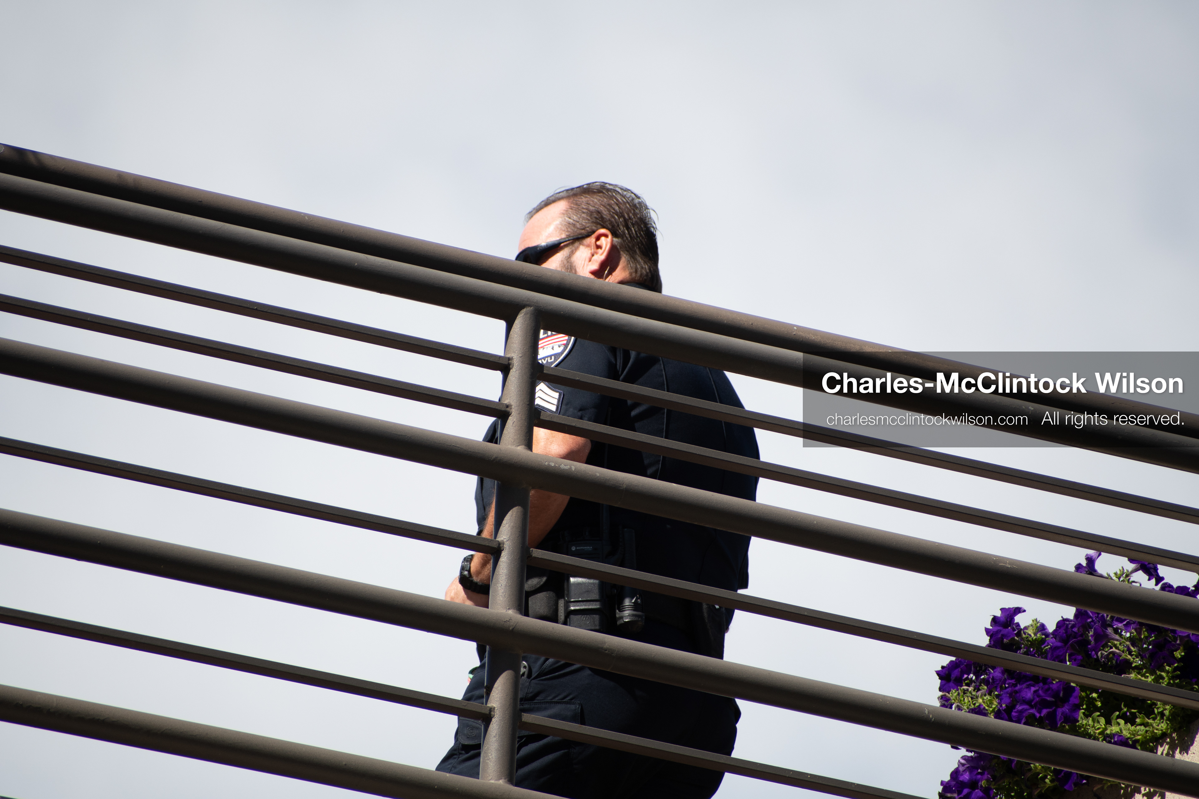 September 10, 2025 – Orem, Utah, United States: A Utah Valley University police officer maintains a security post on an elevated walkway ahead of a scheduled public event featuring conservative activist Charlie Kirk. Photograph by Charles‑McClintock Wilson / ZUMA Press Wire