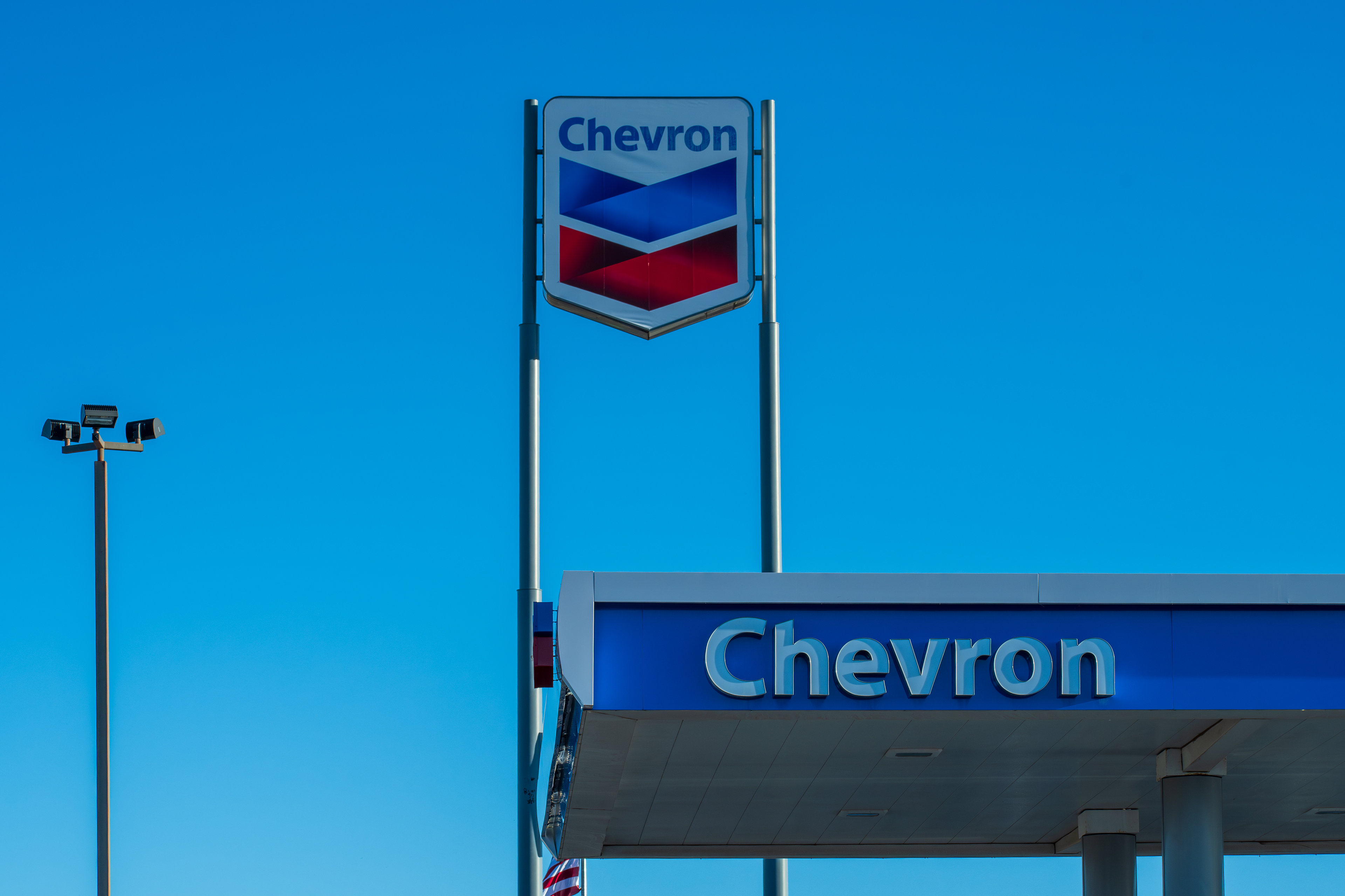 ST. GEORGE, UT, USA - MAY 4, 2025: A Chevron gas station is seen in St. George, Utah. Chevron is an American multinational energy corporation predominantly specializing in oil and gas.
