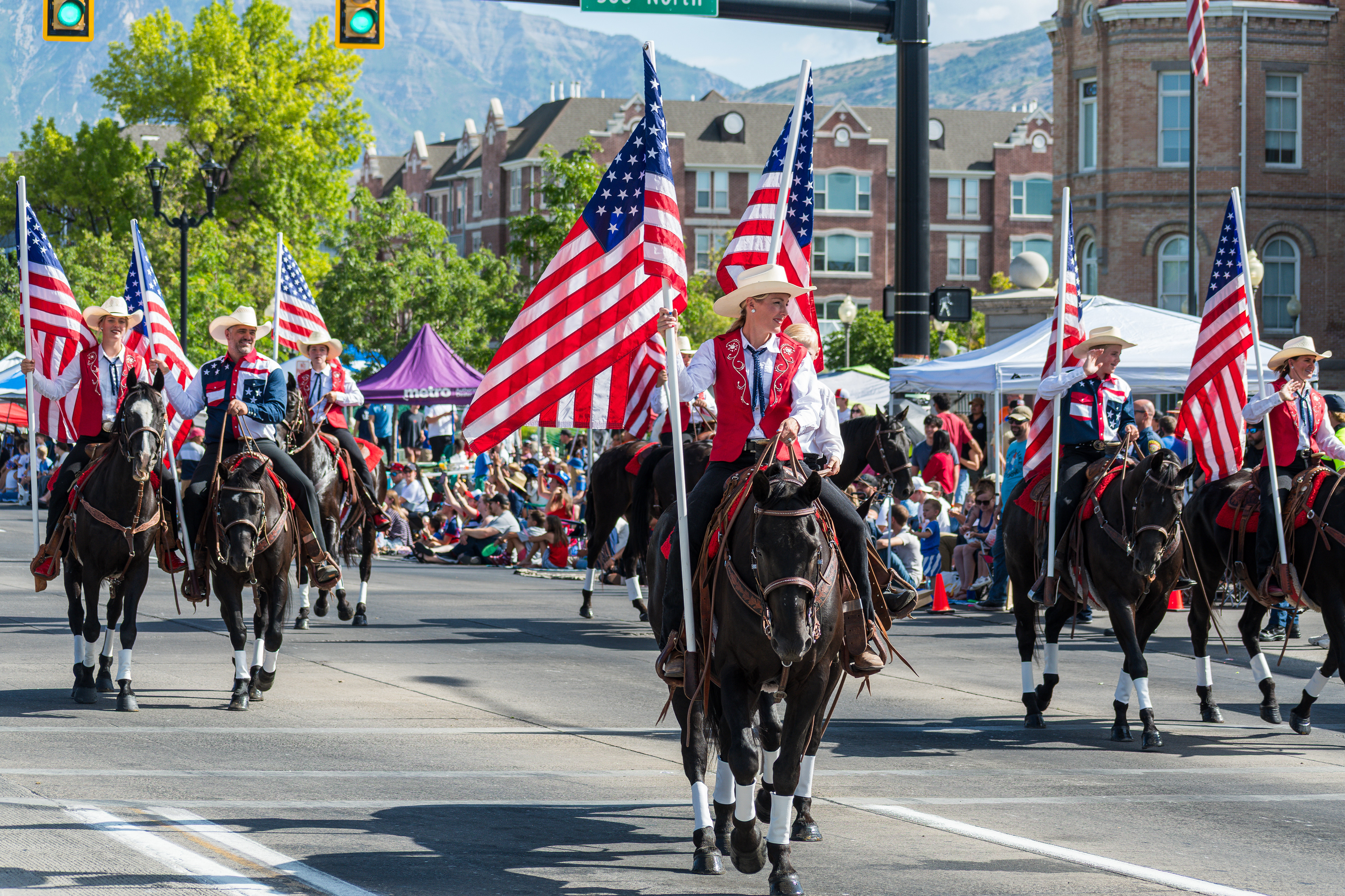 Provo, Utah – July 4, 2025: Riders from a Western equestrian team carry American flags on horseback during the Freedom Festival Grand Parade, adding a patriotic flair to the celebration.