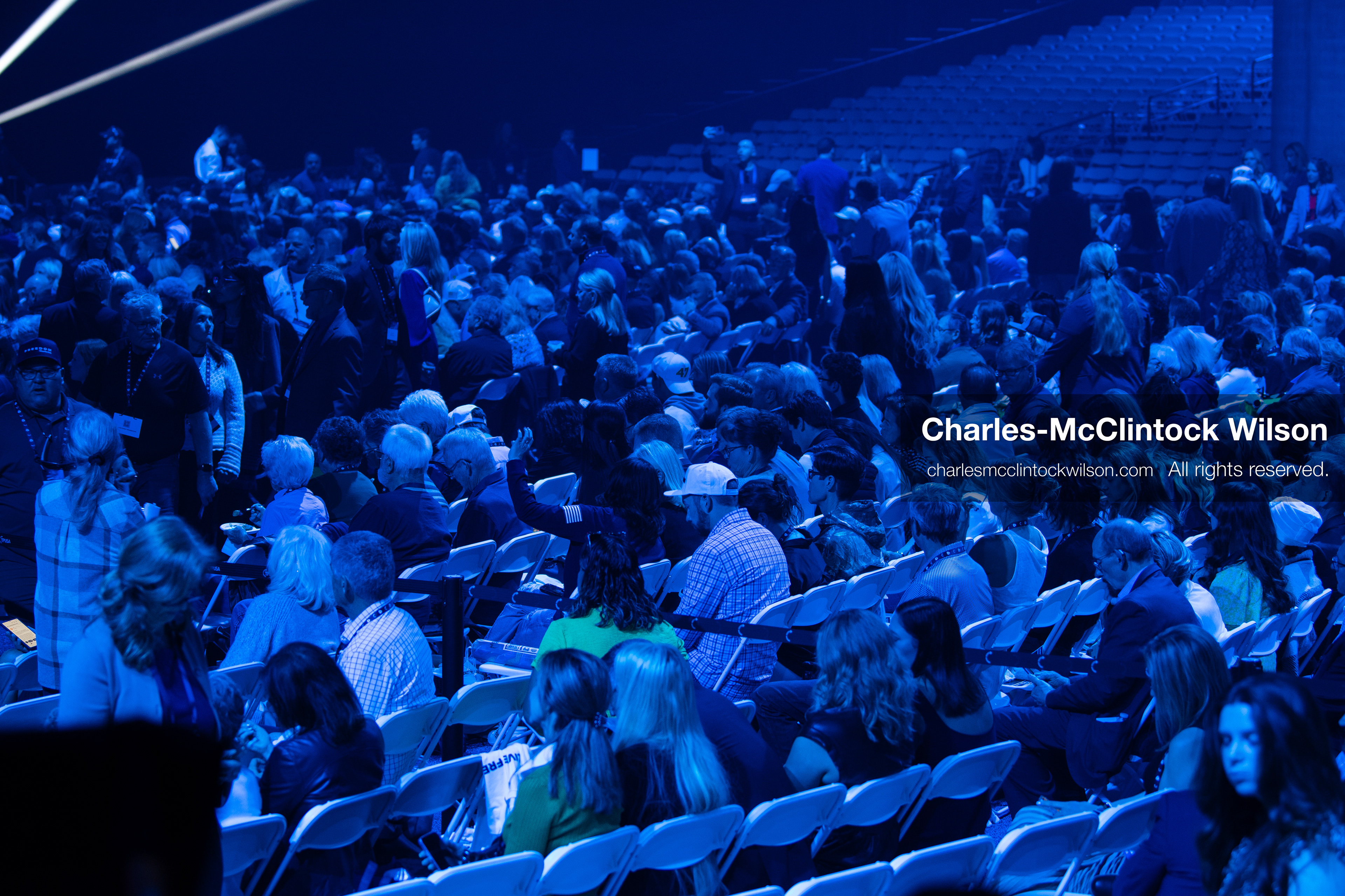 December 18, 2025, Phoenix, Arizona, USA: Attendees fill rows of white chairs under blue lighting during AmericaFest 2025 at the Phoenix Convention Center, the first edition of the event held since the death of Charlie Kirk. (Credit Image: (c) Charles-McClintock Wilson/ZUMA Press Wire)