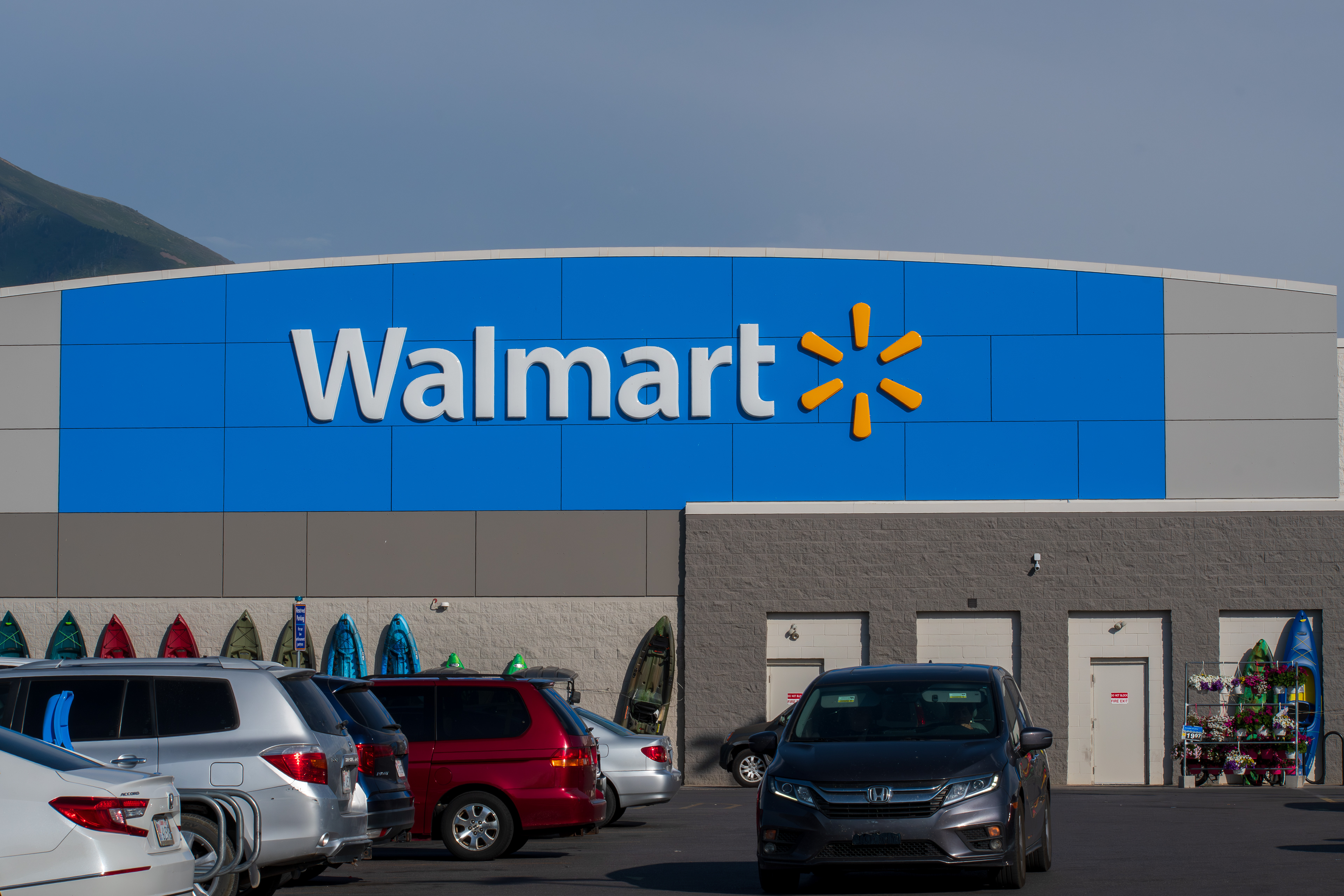 SPANISH FORK, UTAH, USA - JUNE 8, 2025: Exterior view of Walmart storefront. On July 2, 1962, Sam Walton opened the first Walmart store in Rogers, AR.