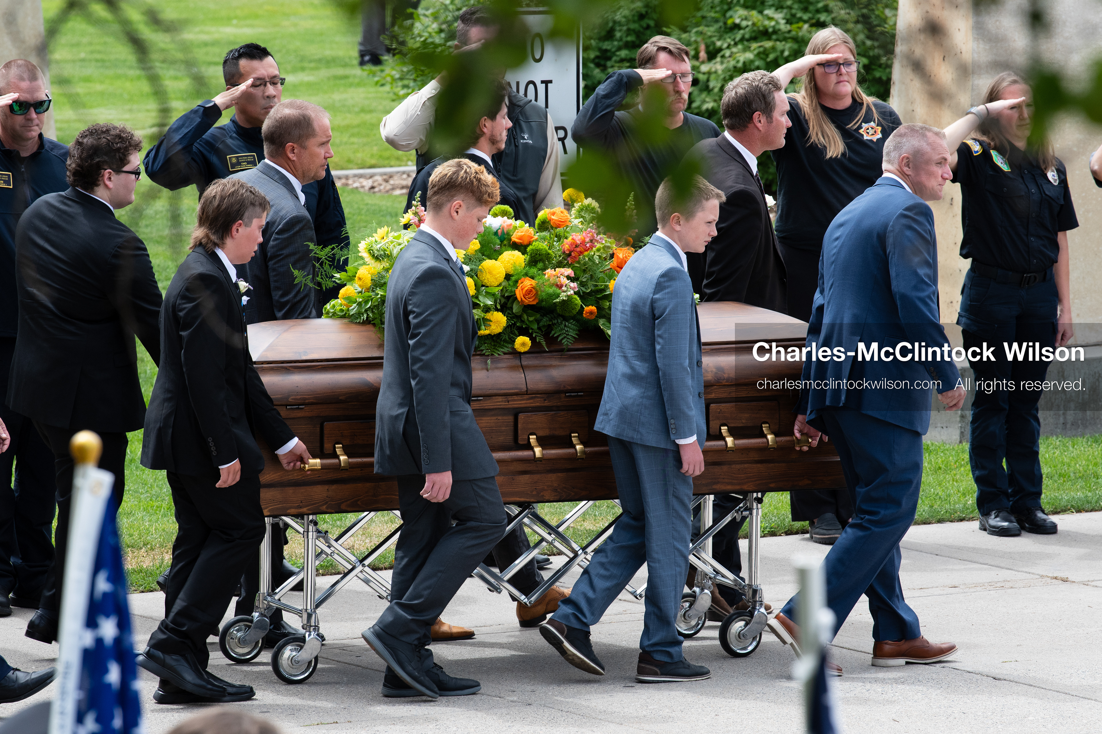Pallbearers and family members escort the casket of a Long family member outside the UCCU Center at Utah Valley University in Orem, Utah, on Wednesday, July 29, 2026. More than 300 people came to the public memorial ceremony to honor Provo Fire Captain Spencer Long, his wife Katrina, and three of their sons, who died after a flash flood hit their campsite near the Sunglow Campground in Wayne County. (Photo by Charles-McClintock Wilson/Sipa USA)