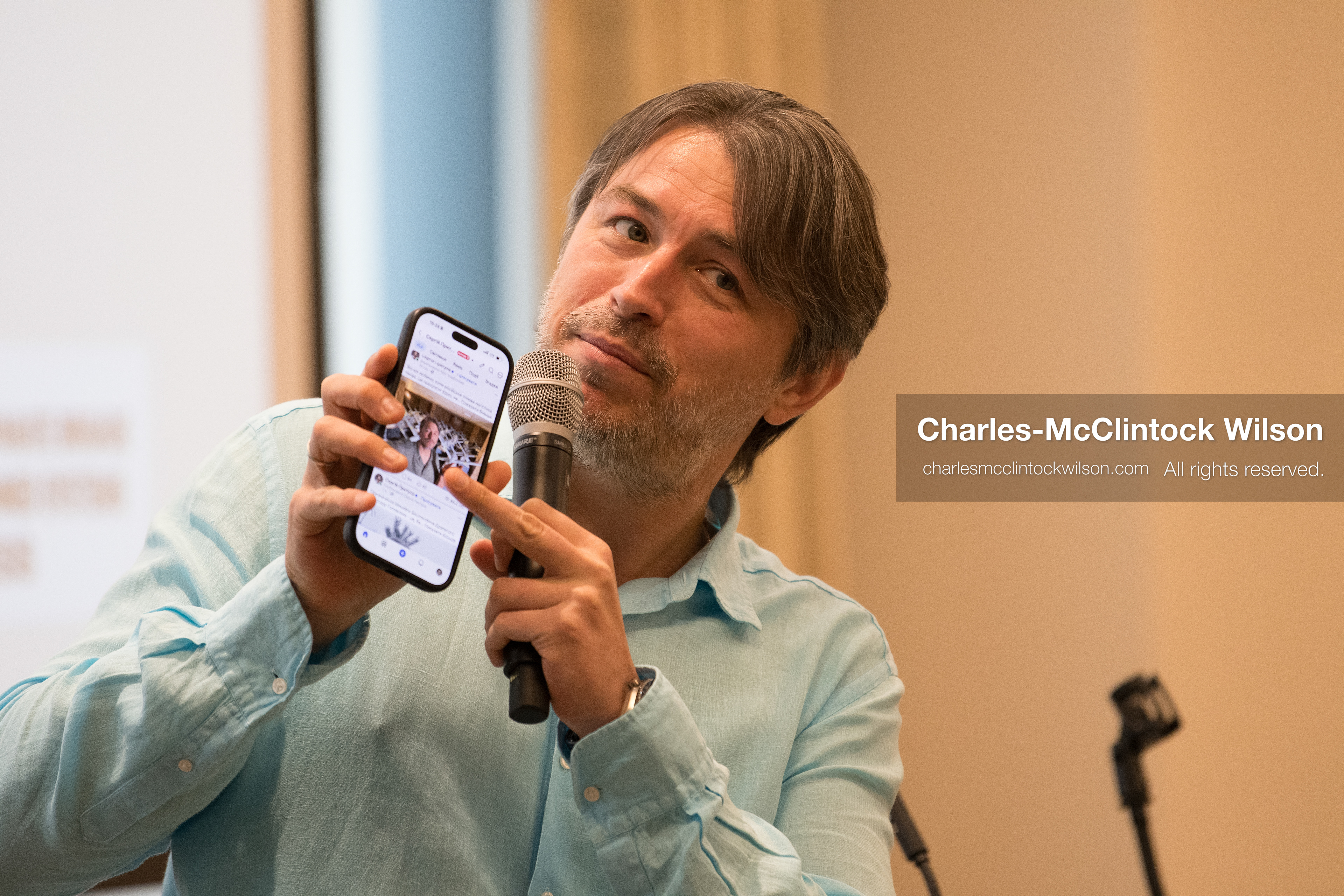 July 23, 2026, Salt Lake City, Utah, USA: Ukrainian activist SERHIY PRYTULA holds up his smartphone to display a photograph to the audience during a community meeting at the Utah State Capitol building in Salt Lake City, Utah, on Thursday, July 23, 2026. The event, titled ''Ukraine in the Fifth Year of the Full-Scale War: An Honest Conversation,'' was hosted by the Prytula Foundation USA to discuss civil defense and ongoing humanitarian aid initiatives. (Credit Image: © Charles-McClintock Wilson/ZUMA Press Wire)
