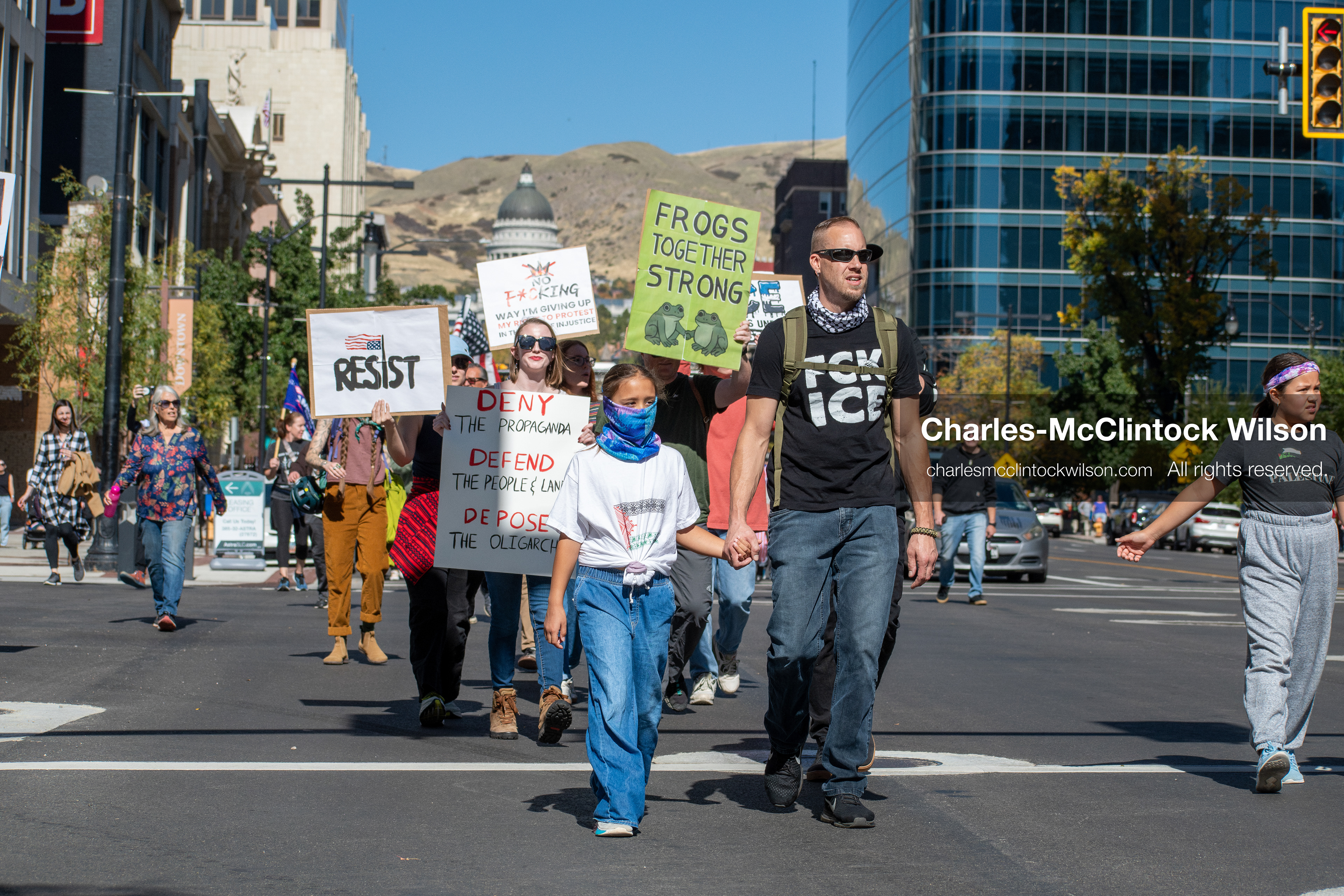 October 18, 2025, Salt Lake City, Utah, USA: Demonstrators march along South State Street during a "No Kings" protest in Salt Lake City, Utah. The protest was part of a nationwide mobilization.