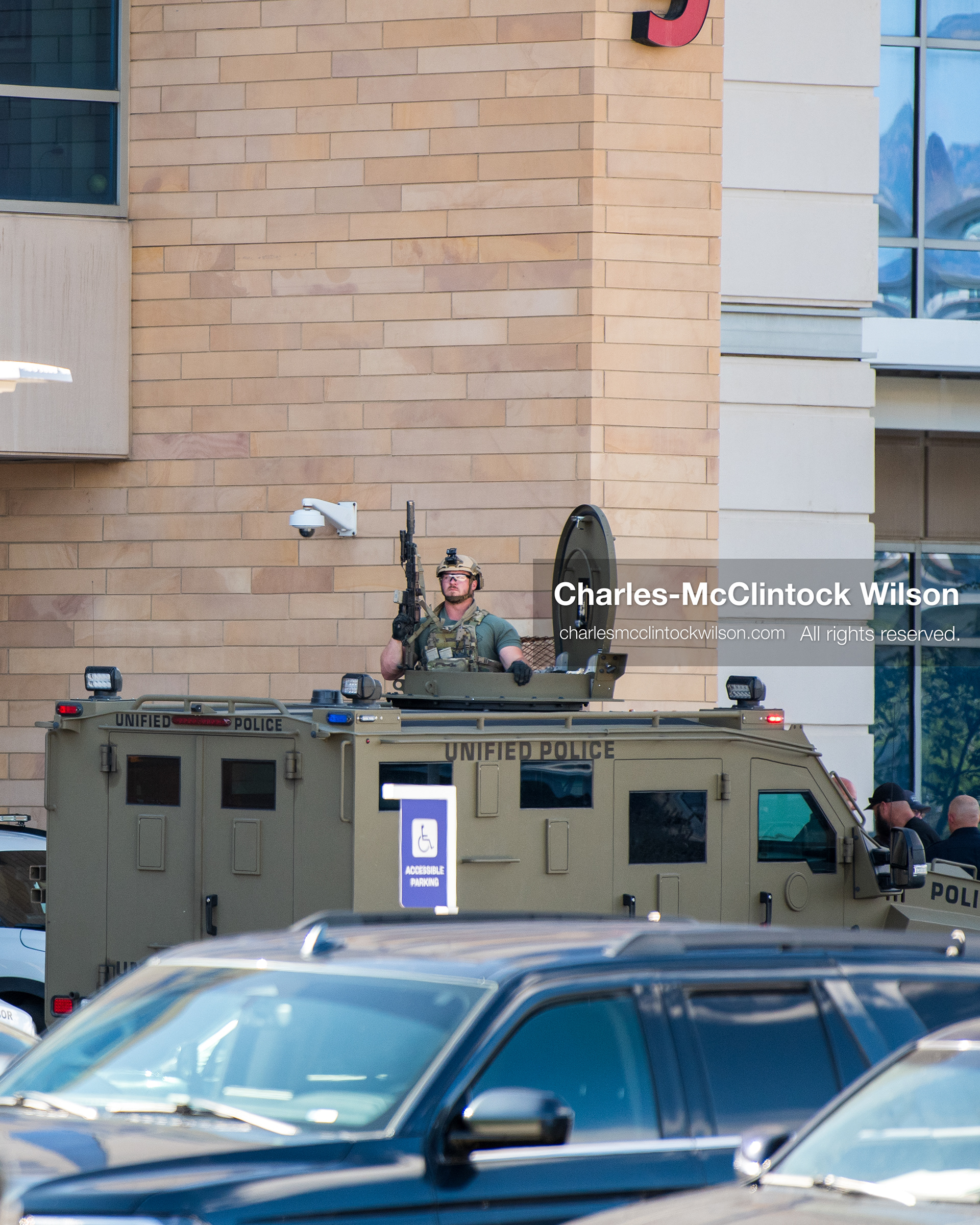 August 17, 2026, Murray, Utah, USA: A law enforcement officer stands inside the roof turret hatch of an armored tactical vehicle outside the emergency department entrance at Intermountain Medical Center in Murray, Utah, on Monday. Multiple police agencies secured the hospital perimeter as a safety precaution after shooting victims were brought in from a fatal shootout outside a funeral in nearby Kearns. (Credit Image: © Charles McClintock Wilson/ZUMA Press Wire)