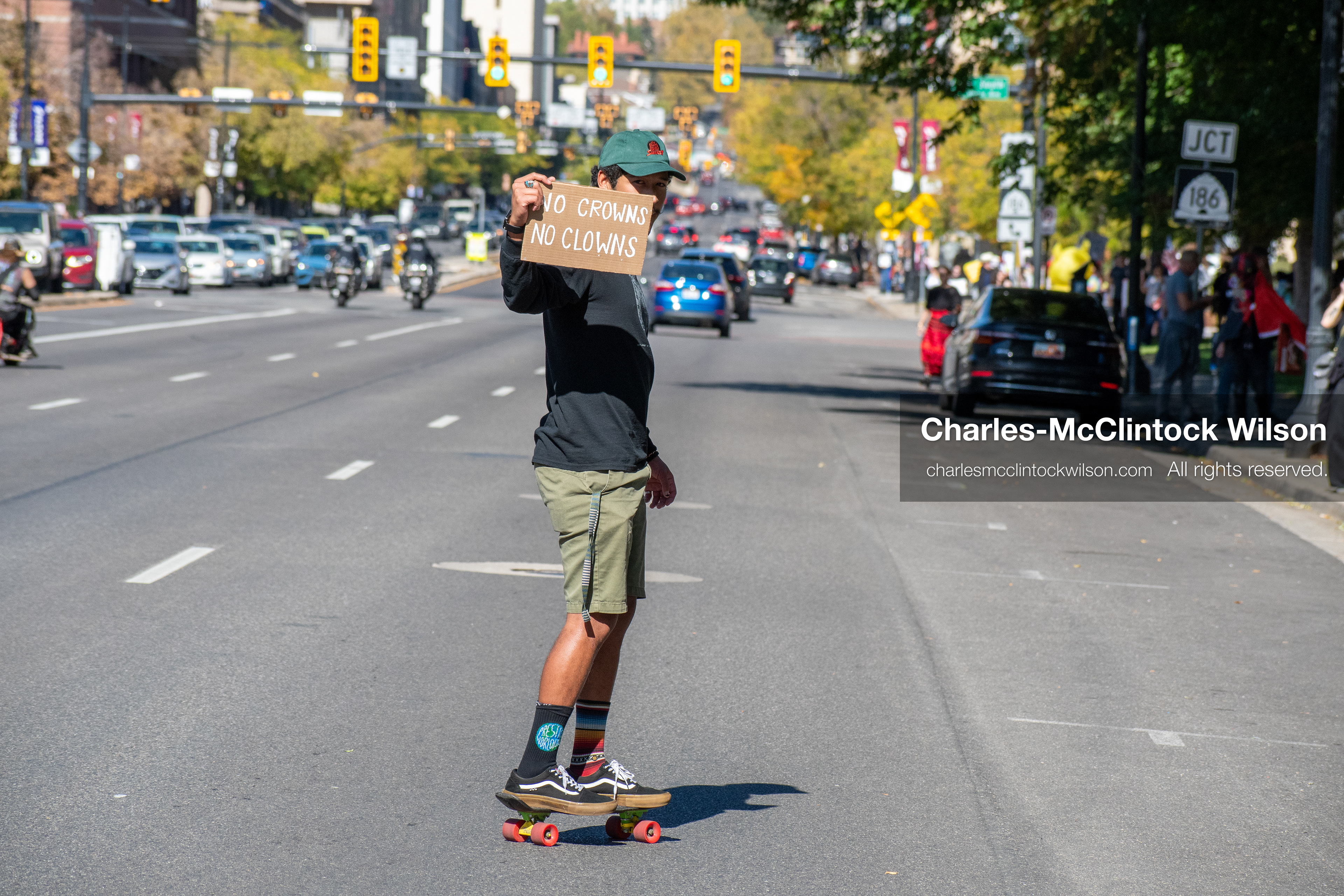 October 18, 2025, Salt Lake City, Utah, USA: A demonstrator skateboards with a protest sign during a "No Kings" protest in Salt Lake City, Utah. The protest was part of a nationwide mobilization.
