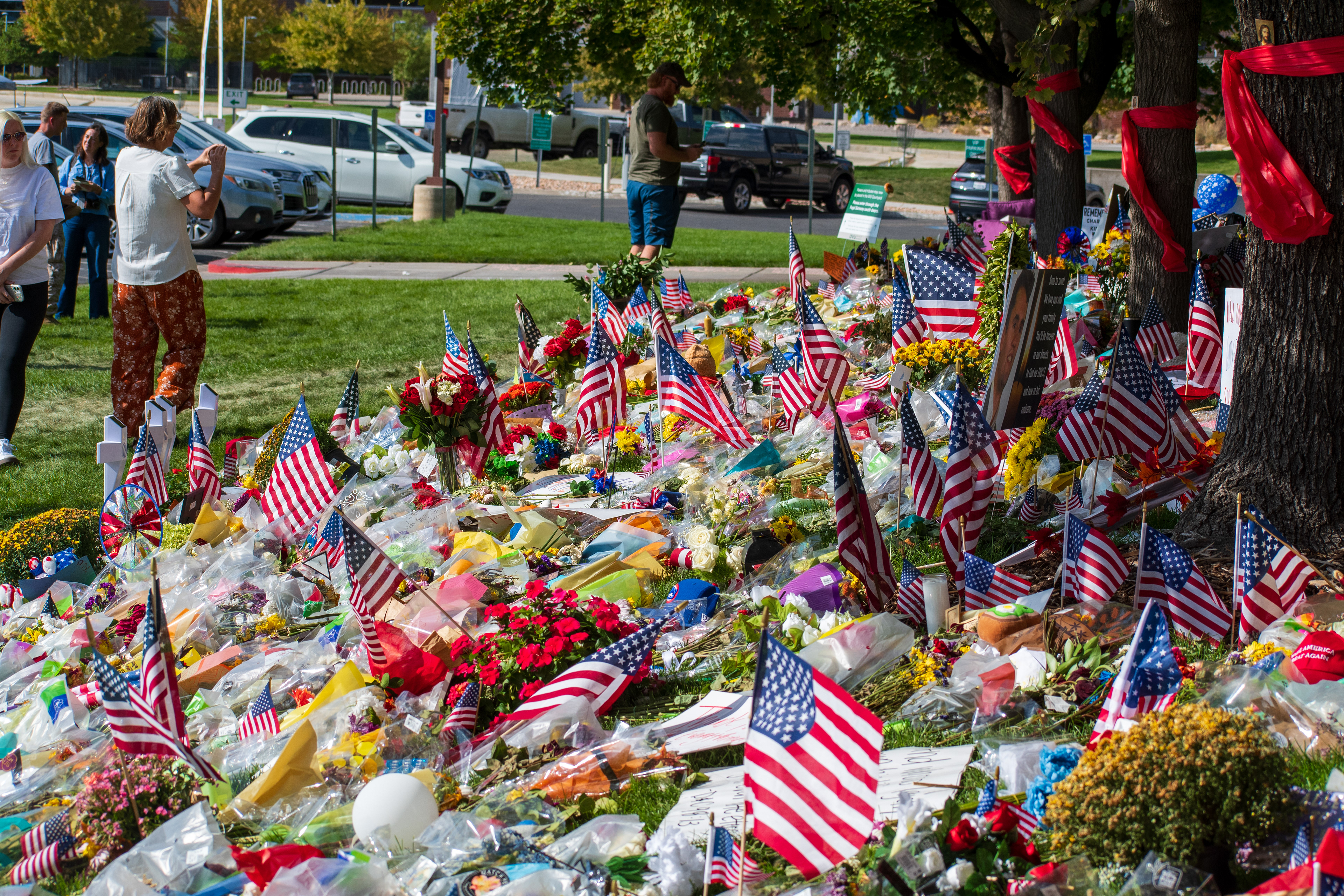 OREM, UTAH – SEPTEMBER 15, 2025: A memorial honoring Charlie Kirk is seen on the campus of Utah Valley University, featuring American flags, candles, flowers, and handwritten signs arranged around a large portrait. The tribute appeared days after Kirk’s final public event at the university. © Charles‑McClintock Wilson / ZUMA Press