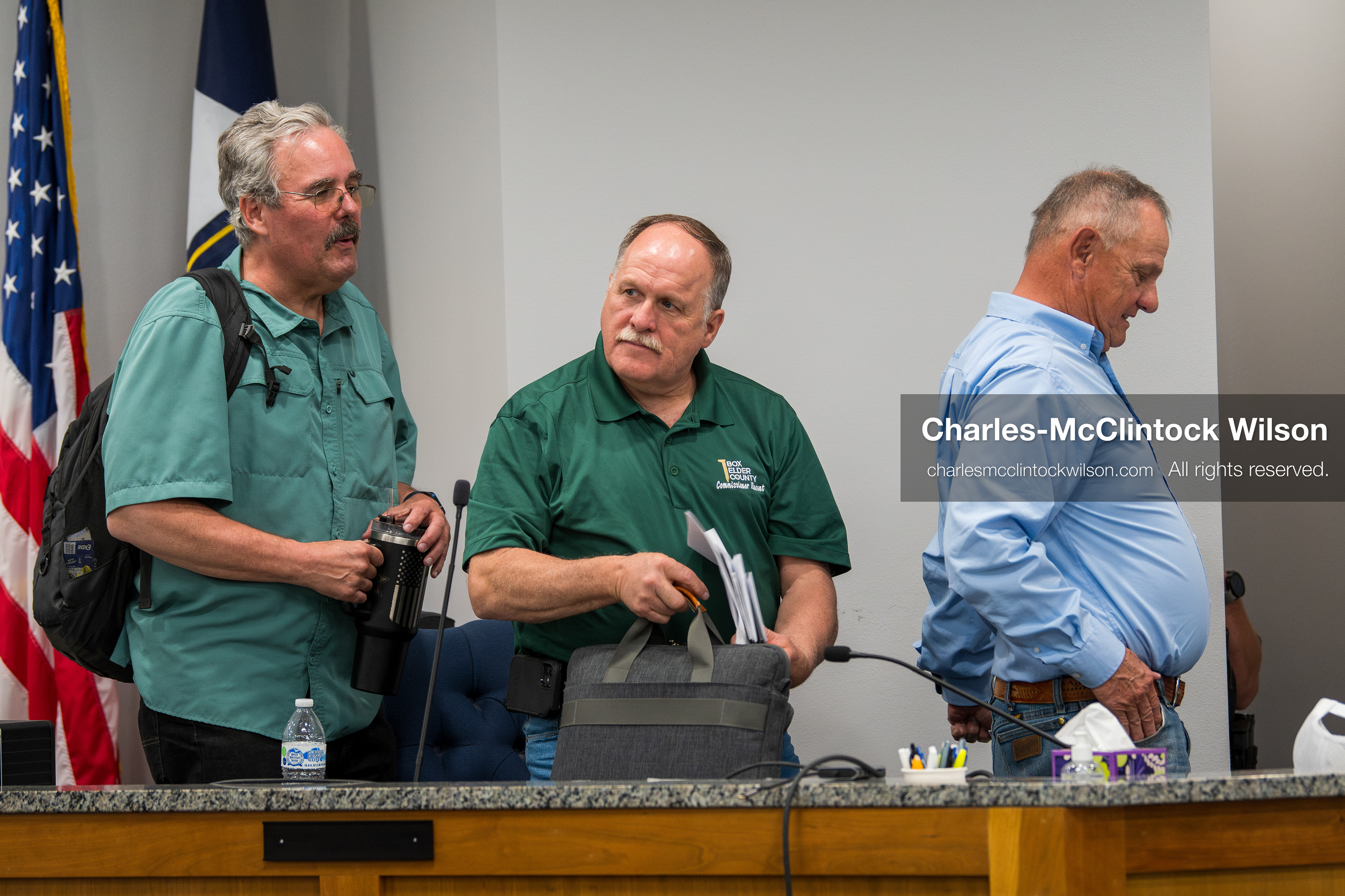 May 13, 2026, Brigham City, Utah, USA: Box Elder County Commissioners, from left to right, LEE PERRY, TYLER VINCENT, and BOYD BRIGHAM, gather their materials following the Box Elder County Commission meeting inside the Box Elder County Justice Center in Brigham City, Utah. The meeting addressed the proposed data‑center project backed by businessman Kevin O’Leary, which has drawn public concern over water use, power demand, and transparency. (Credit Image: © Charles‑McClintock Wilson/ZUMA Press Wire)