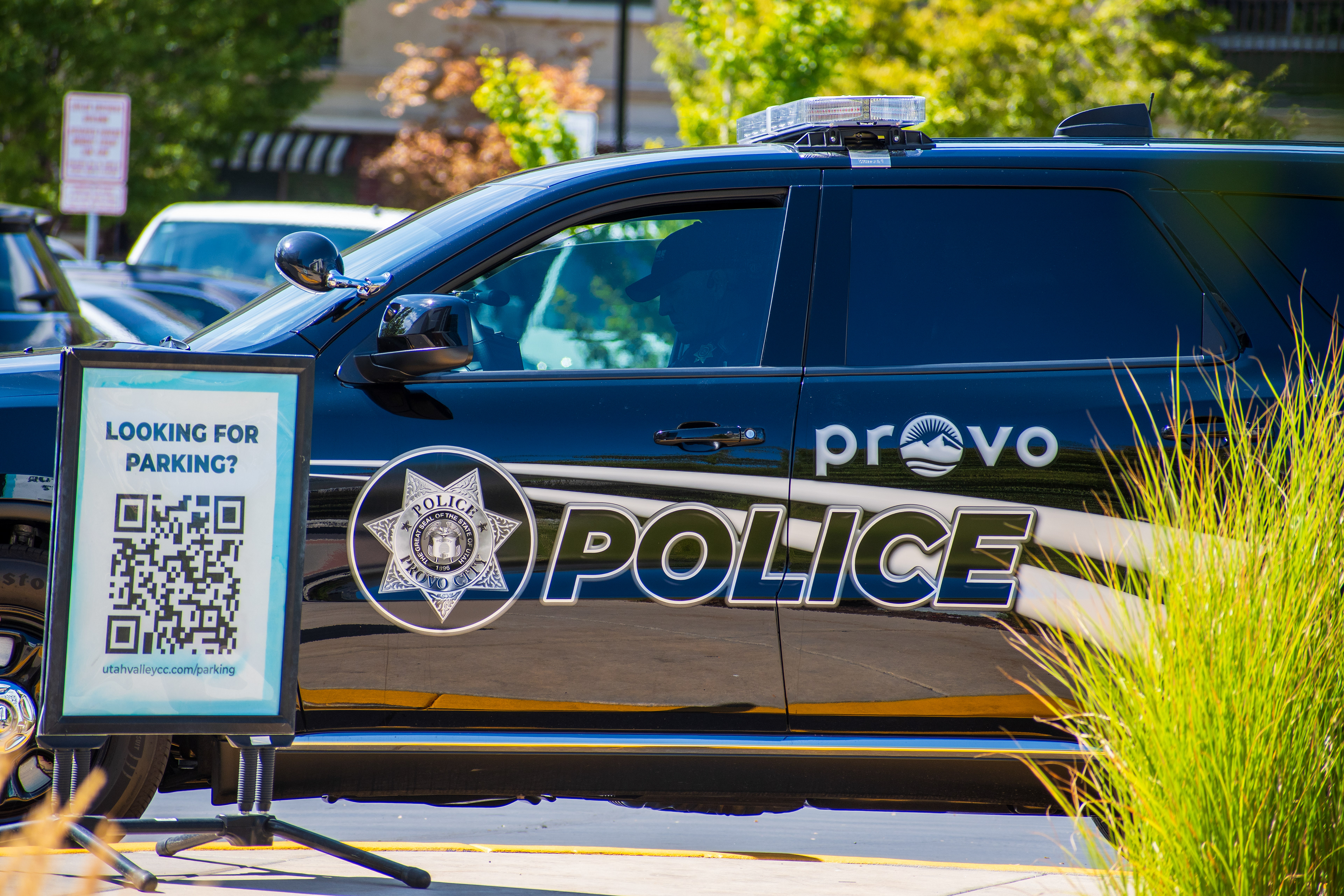 September 15, 2025 – Provo, Utah, United States: A Provo Police Department vehicle is parked near the Utah Valley Convention Center during a Department of Homeland Security career expo focused on recruiting law enforcement and security personnel. A nearby sign offers digital parking assistance via QR code. Photograph by Charles‑McClintock Wilson / ZUMA Press Wire